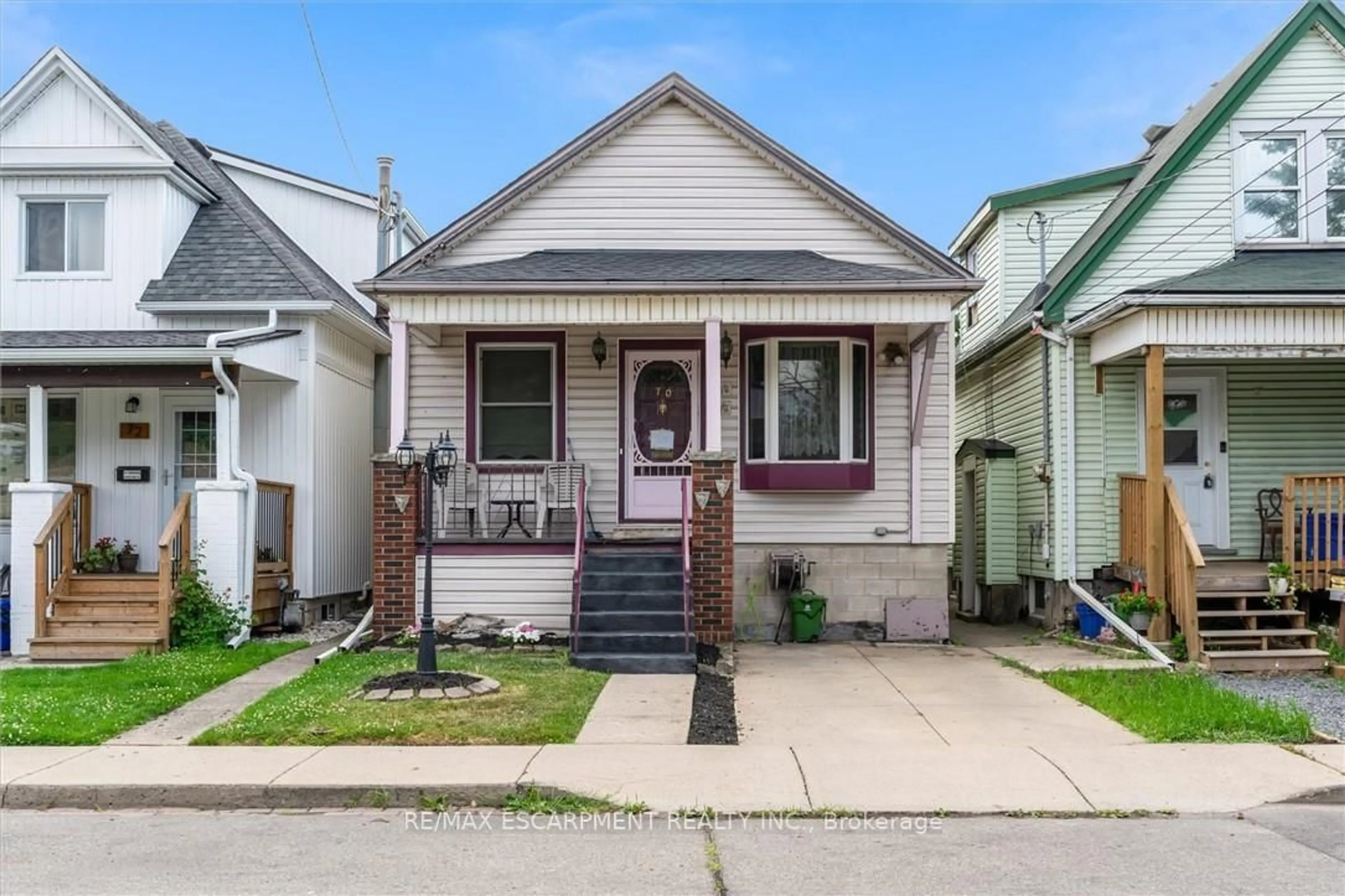 Home with vinyl exterior material, street for 70 Norman St, Hamilton Ontario L8H 4J5