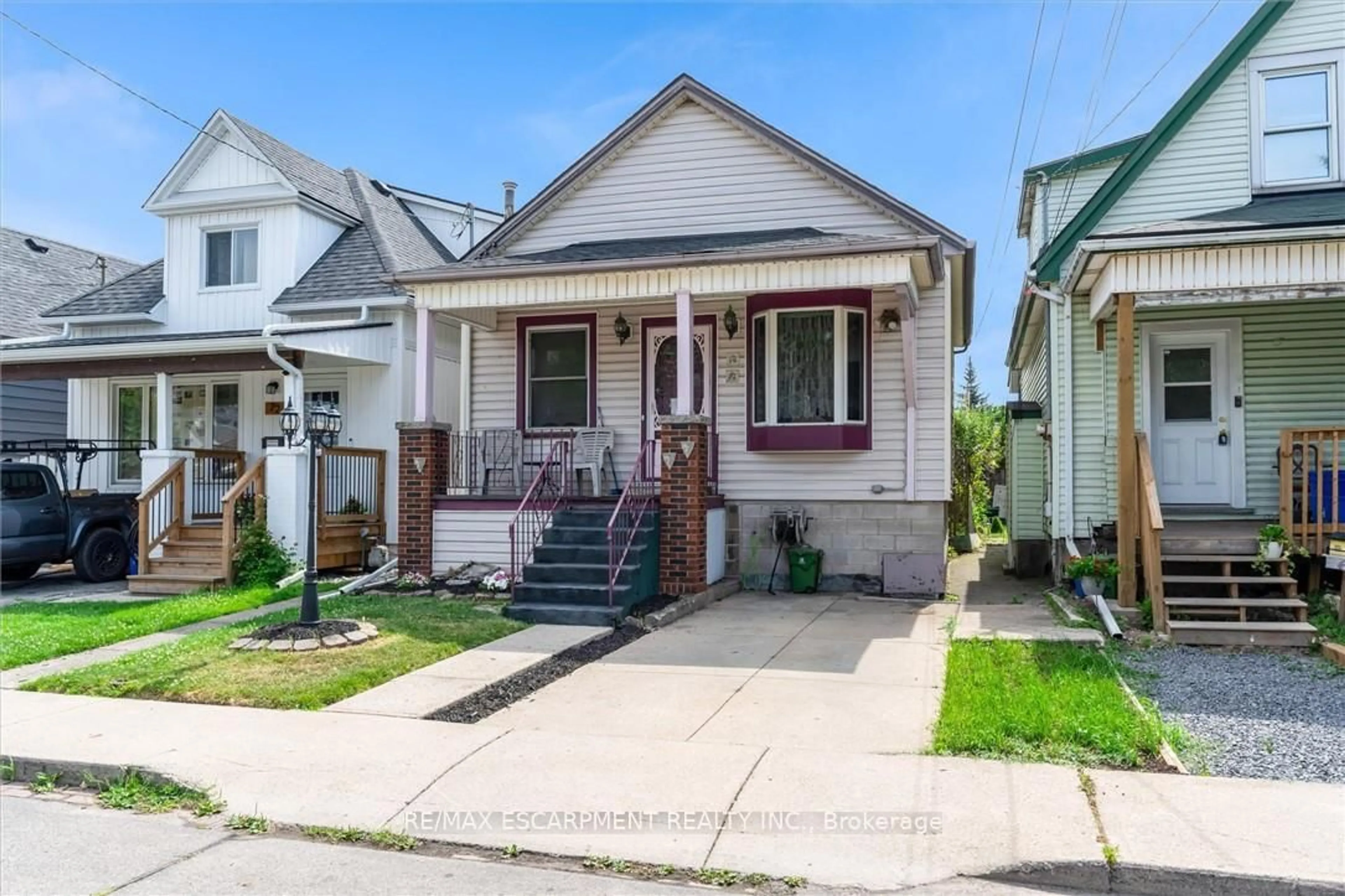 Home with vinyl exterior material, street for 70 Norman St, Hamilton Ontario L8H 4J5