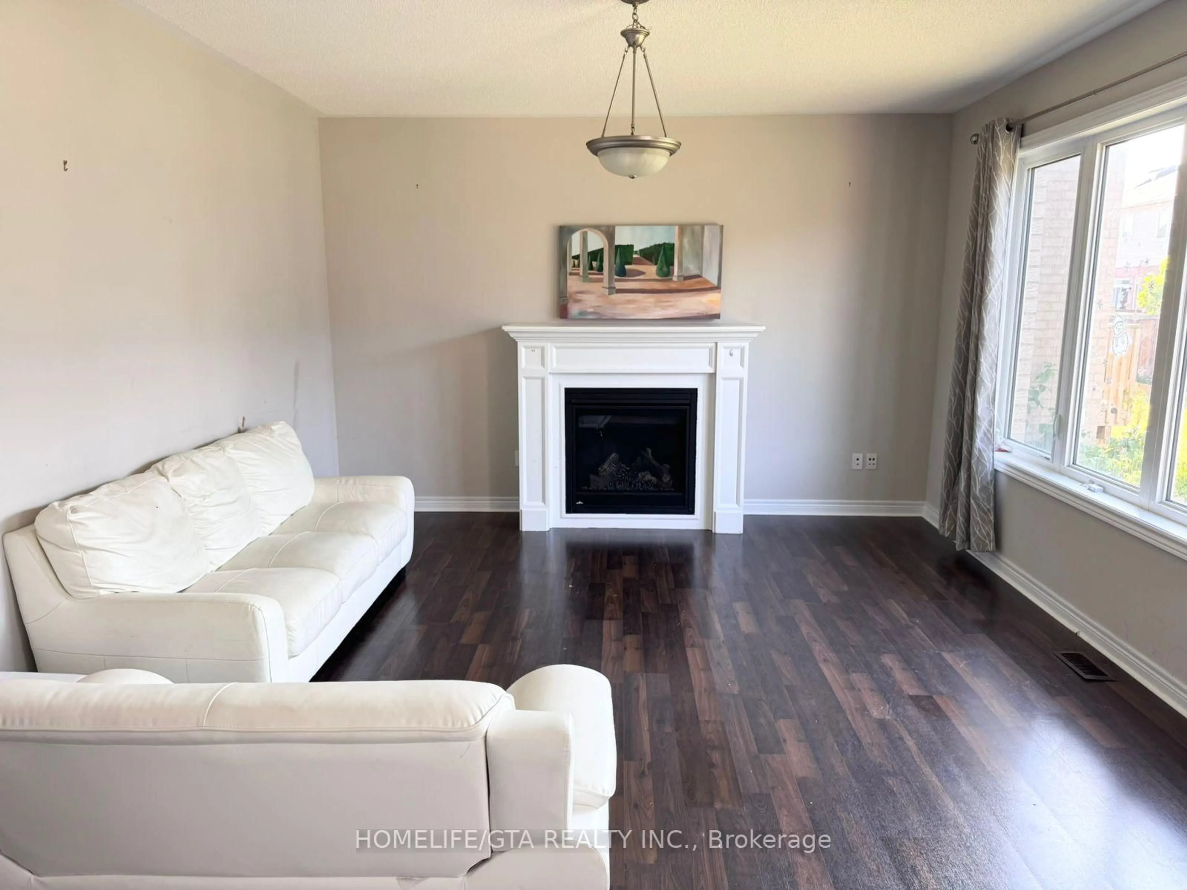 Living room with furniture, wood/laminate floor for 61 Barlow Pl, Brant Ontario N3L 0H1