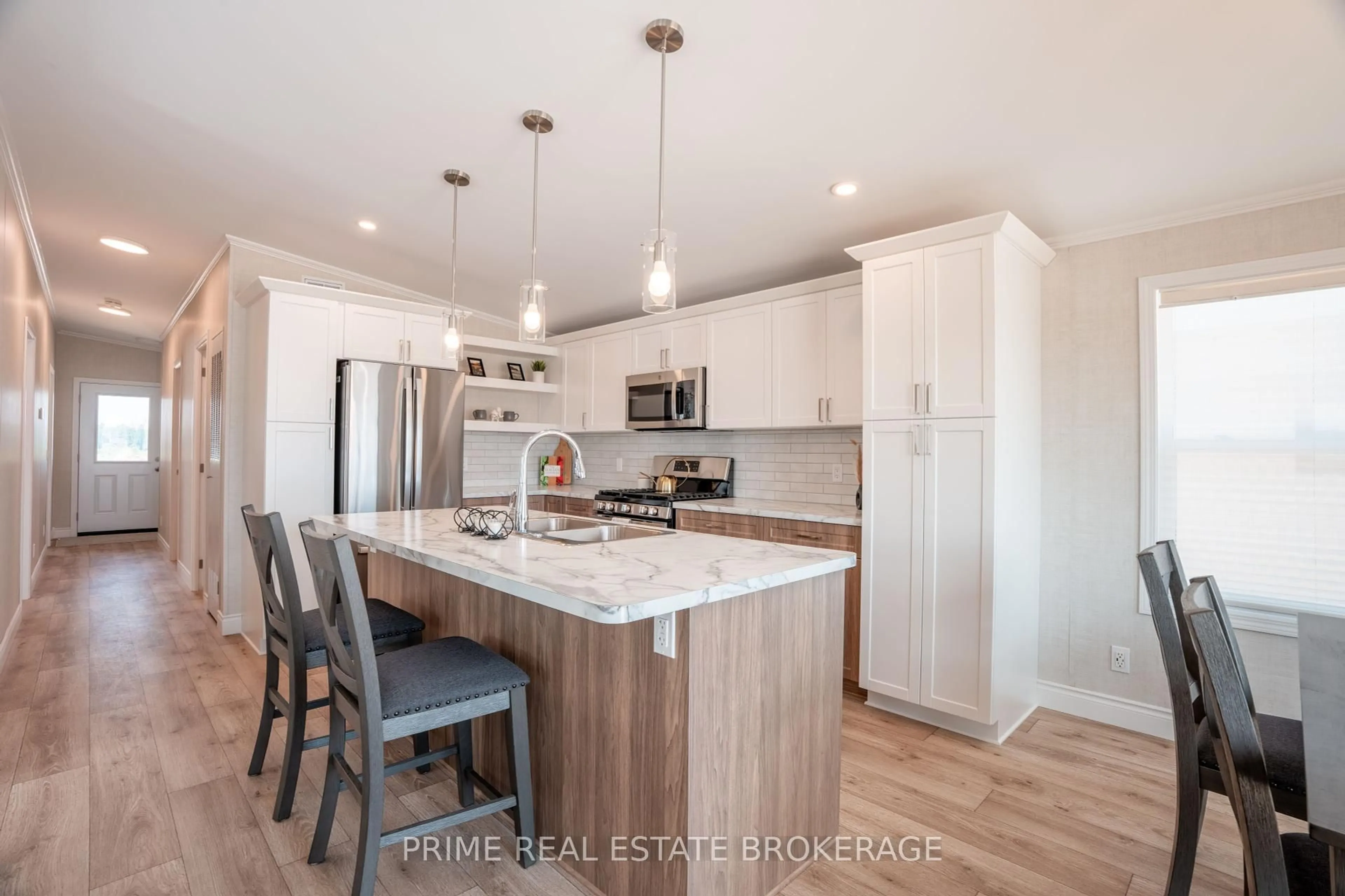 Open concept kitchen, wood/laminate floor for 213 Carolynn Way #Lot 8, North Perth Ontario N4W 3G8