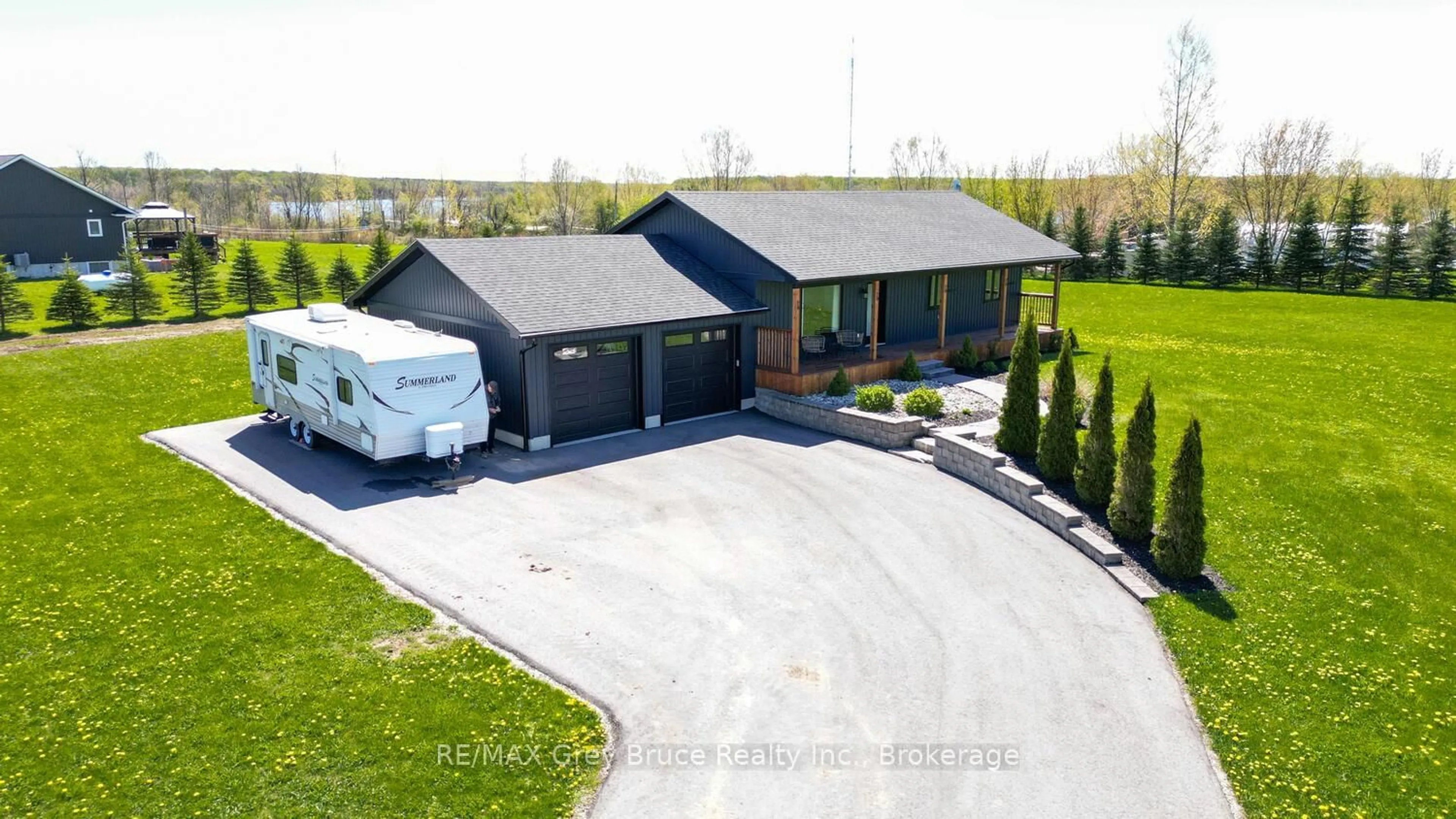 A pic from outside/outdoor area/front of a property/back of a property/a pic from drone, street for 116 PATTERSON Pkwy, Georgian Bluffs Ontario N0H 2T0