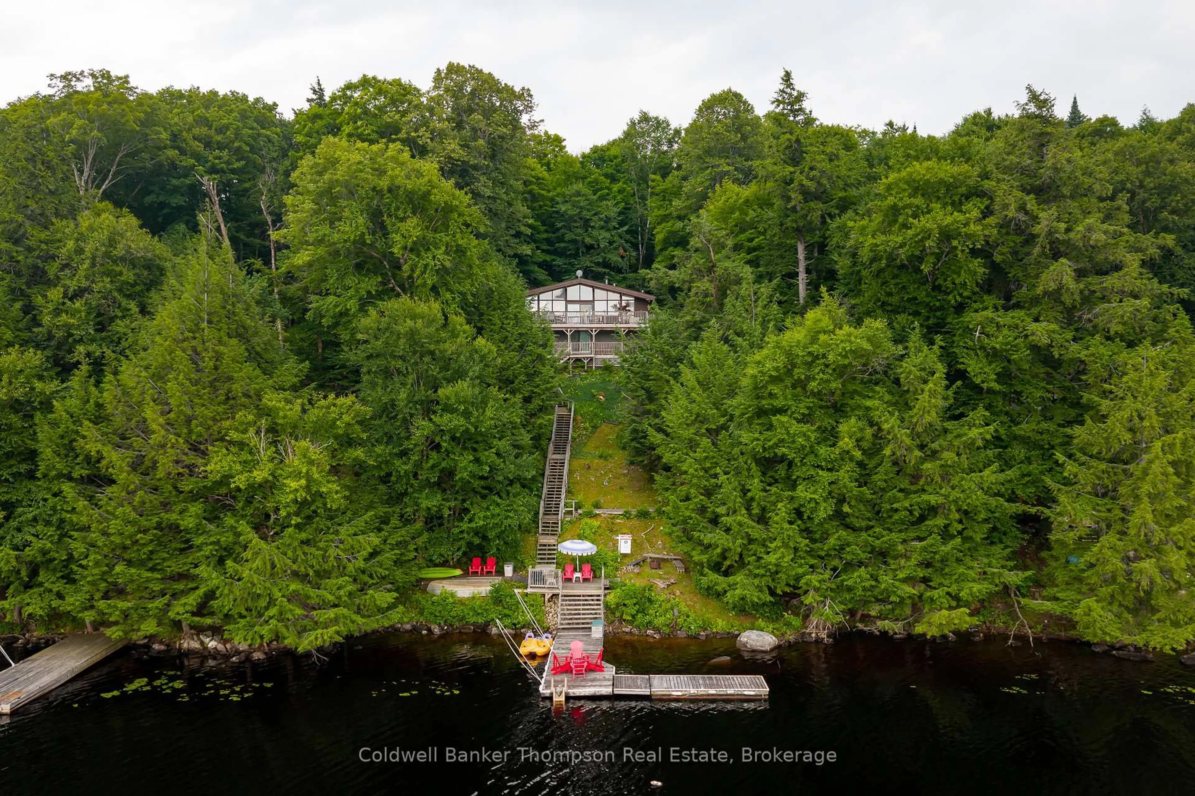 A pic from outside/outdoor area/front of a property/back of a property/a pic from drone, water/lake/river/ocean view for 310 North Dr, Huntsville Ontario P1H 2J2