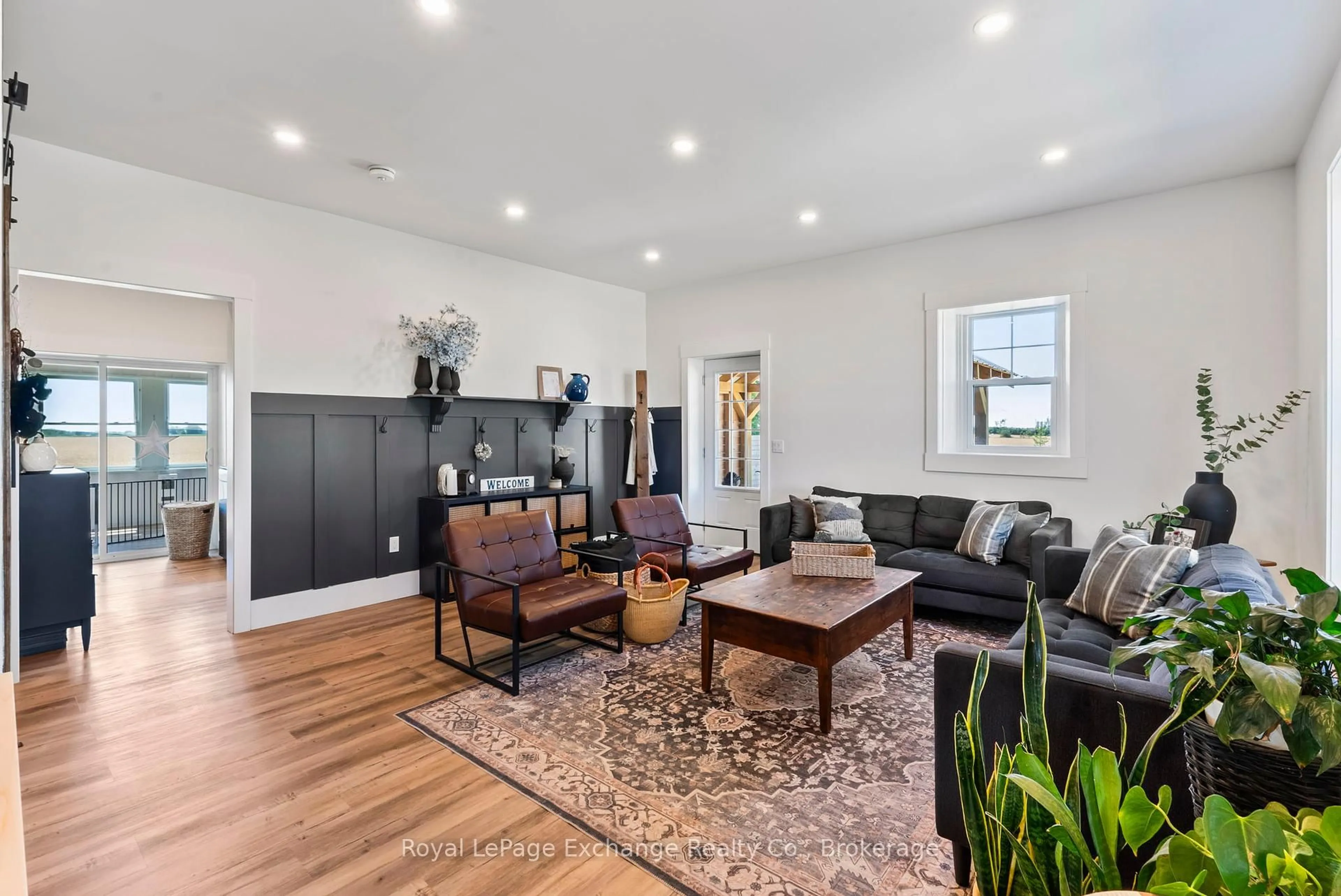 Living room with furniture, wood/laminate floor for 1165 Sideroad 30 Sdrd, Huron-Kinloss Ontario N0G 2R0