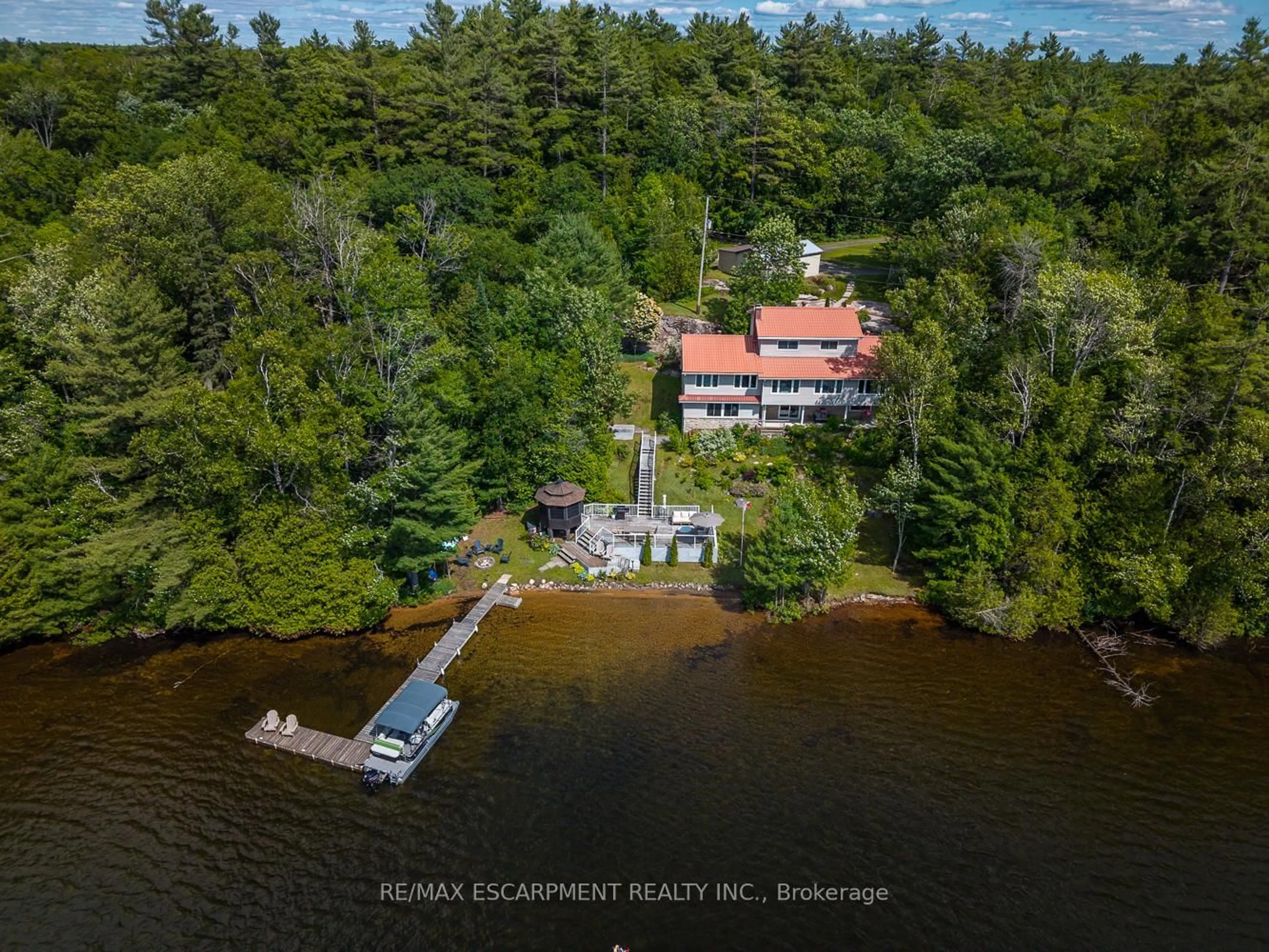 A pic from outside/outdoor area/front of a property/back of a property/a pic from drone, water/lake/river/ocean view for 32 10th Concession Rd, Seguin Ontario P2A 2W8