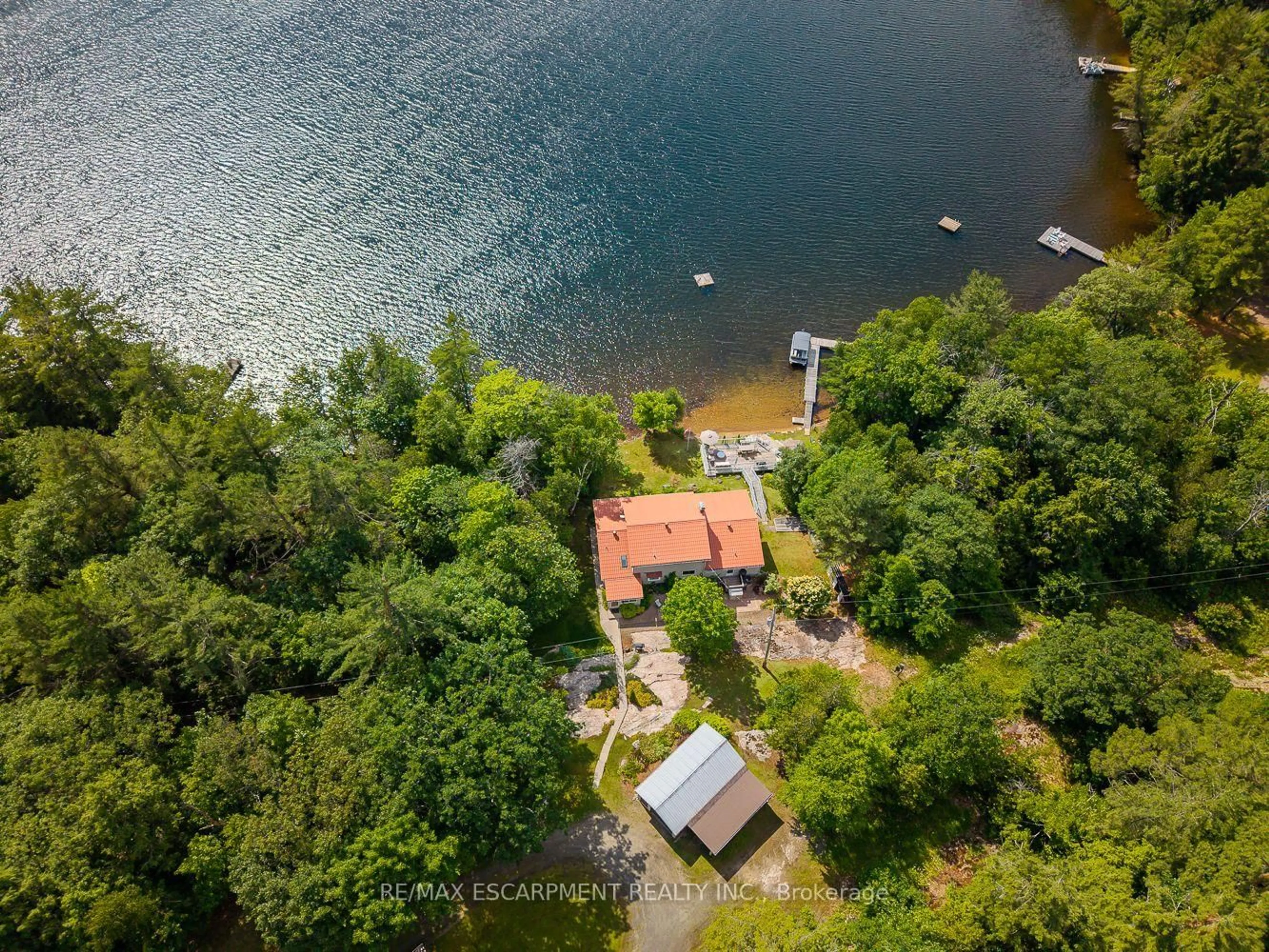 A pic from outside/outdoor area/front of a property/back of a property/a pic from drone, water/lake/river/ocean view for 32 10th Concession Rd, Seguin Ontario P2A 2W8