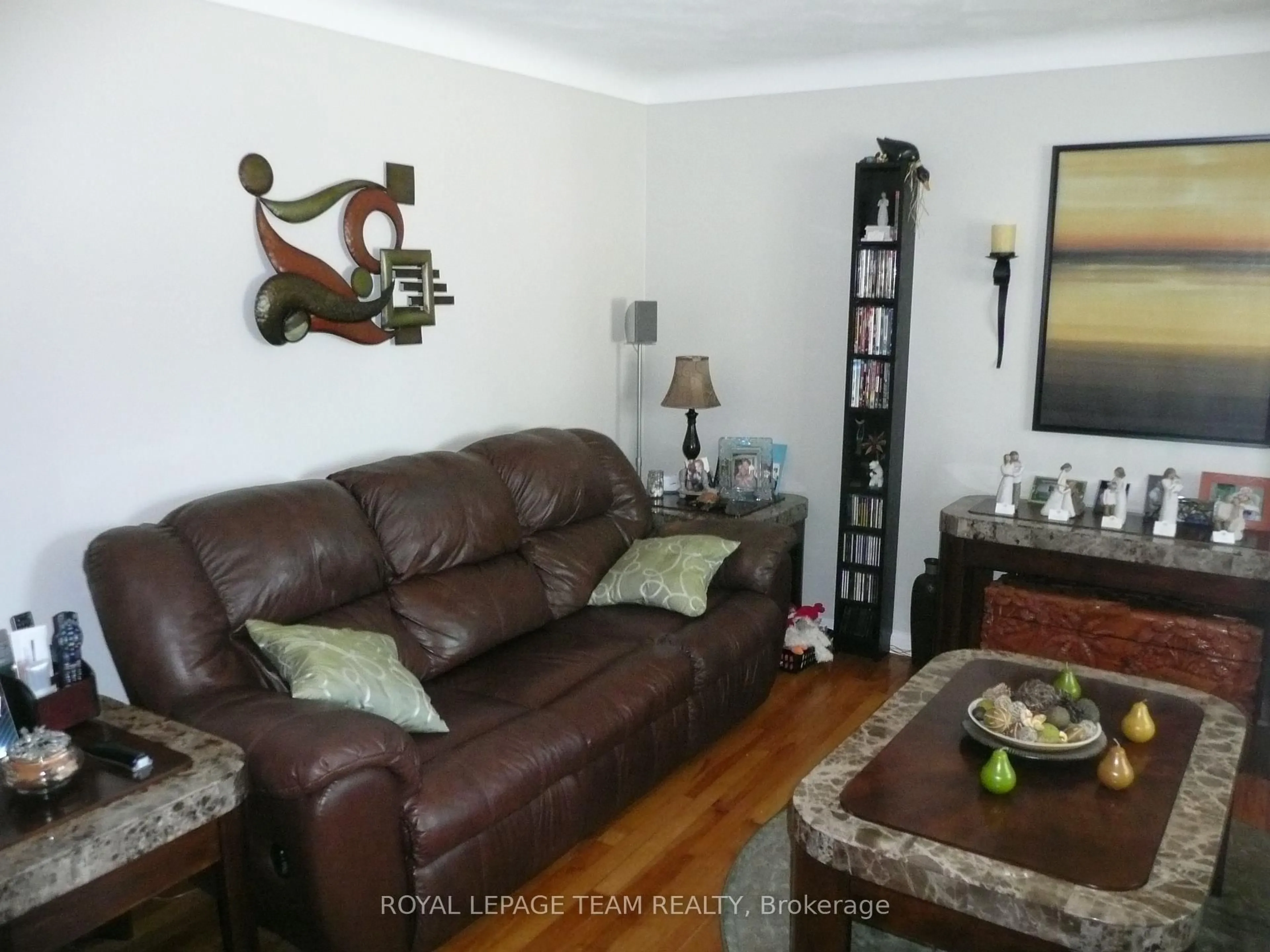 Living room with furniture, wood/laminate floor for 775 Trojan Ave, Ottawa Ontario K1K 2P6
