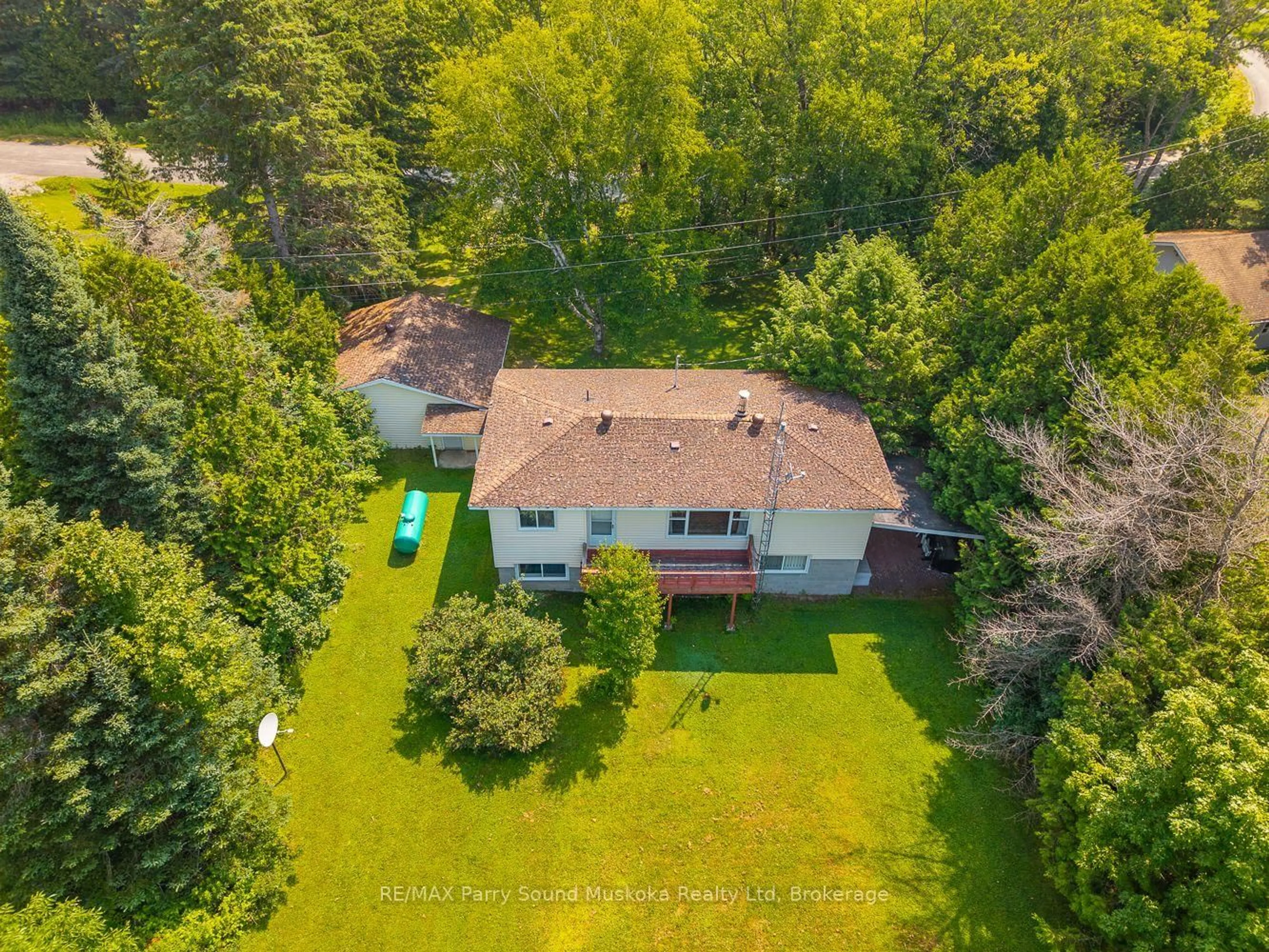 A pic from outside/outdoor area/front of a property/back of a property/a pic from drone, forest/trees view for 86 Lakeside Cres, McKellar Ontario P2A 0B4