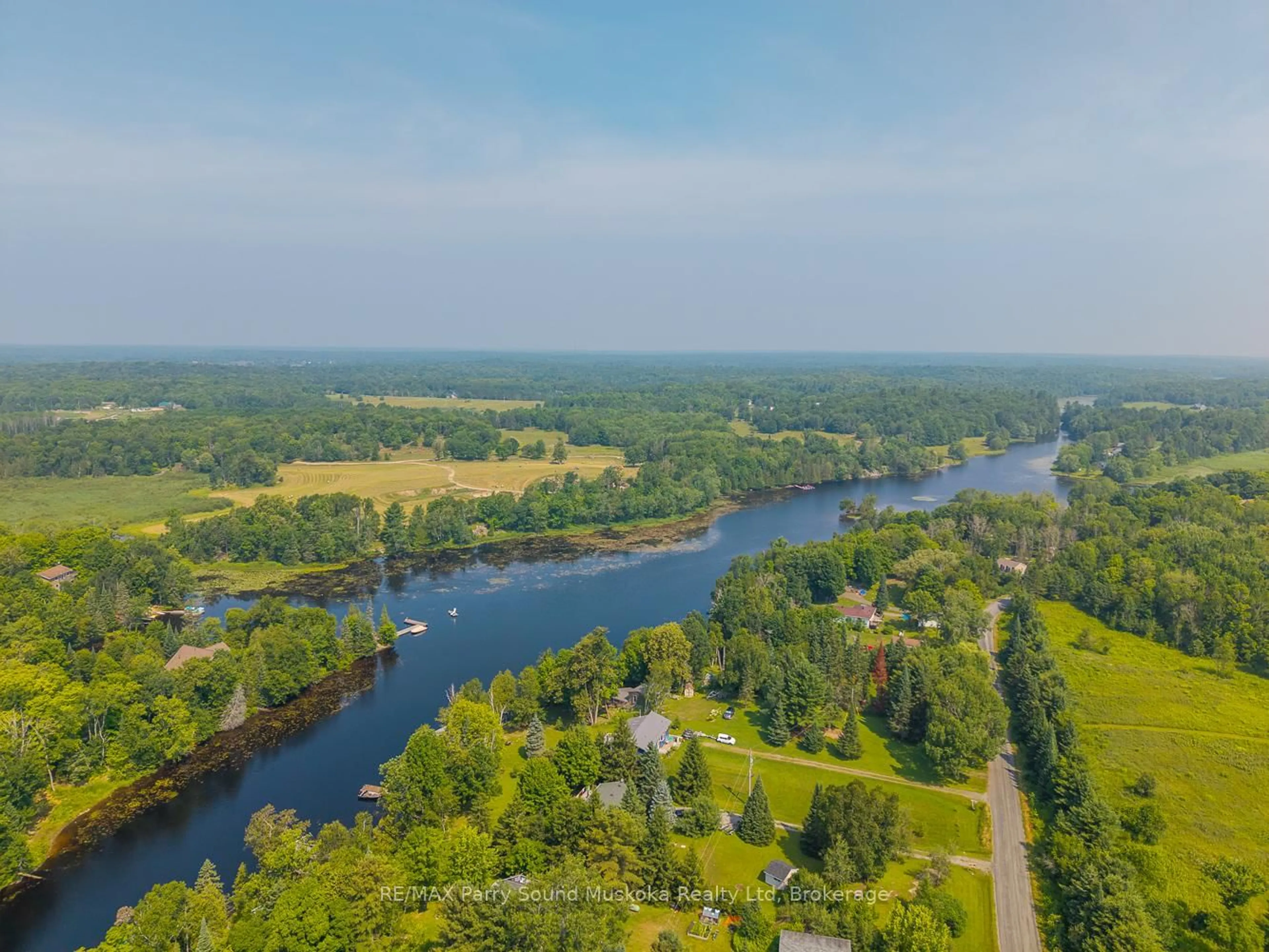 A pic from outside/outdoor area/front of a property/back of a property/a pic from drone, water/lake/river/ocean view for 86 Lakeside Cres, McKellar Ontario P2A 0B4
