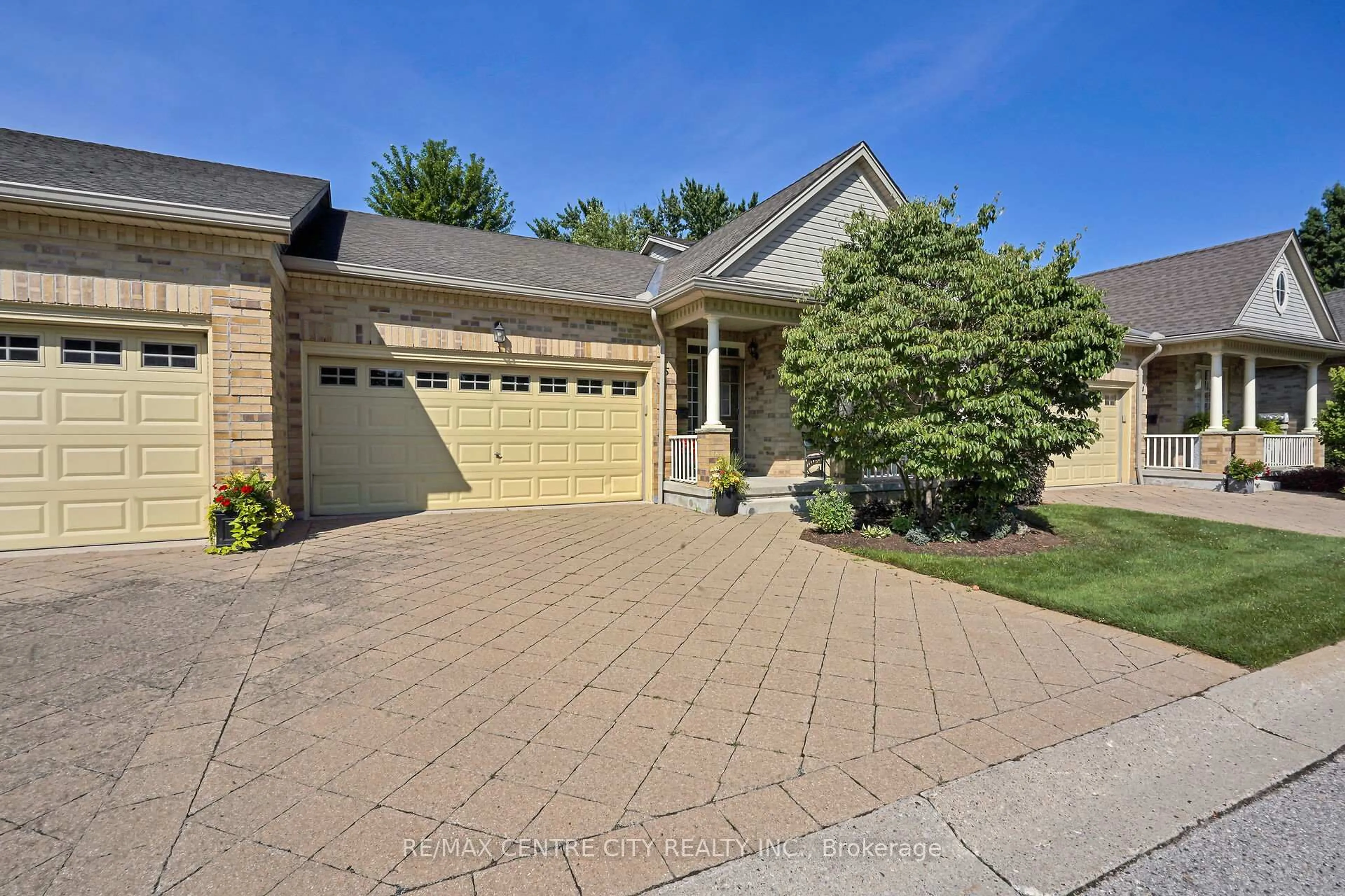 Home with brick exterior material, street for 21 St Johns Dr #5, Middlesex Centre Ontario N0M 1C0