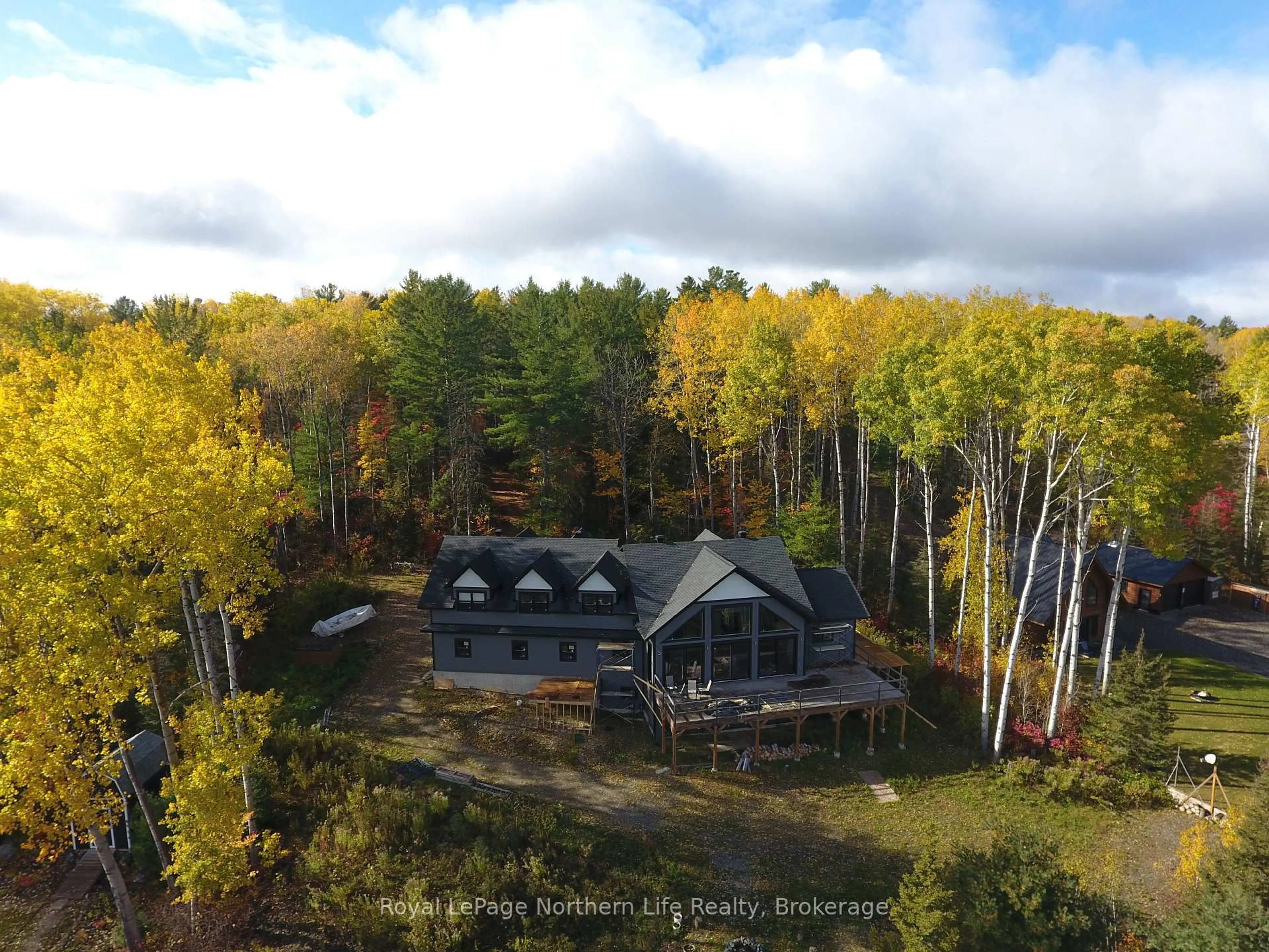 A pic from outside/outdoor area/front of a property/back of a property/a pic from drone, forest/trees view for 429 FOX RUN Dr, Temagami Ontario P0H 2H0