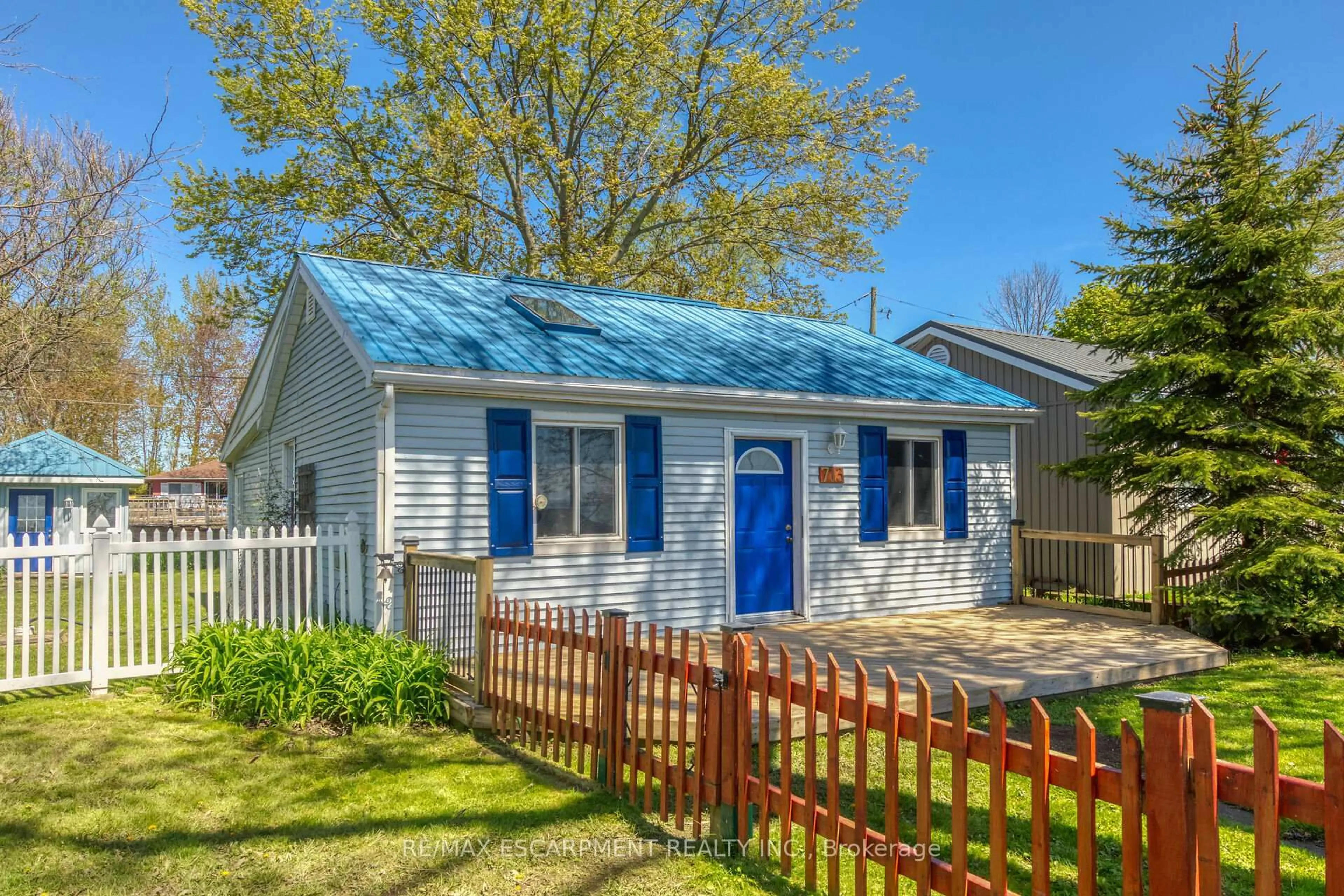 Home with vinyl exterior material, street for 713 Lakeshore Rd, Haldimand Ontario N0A 1P0