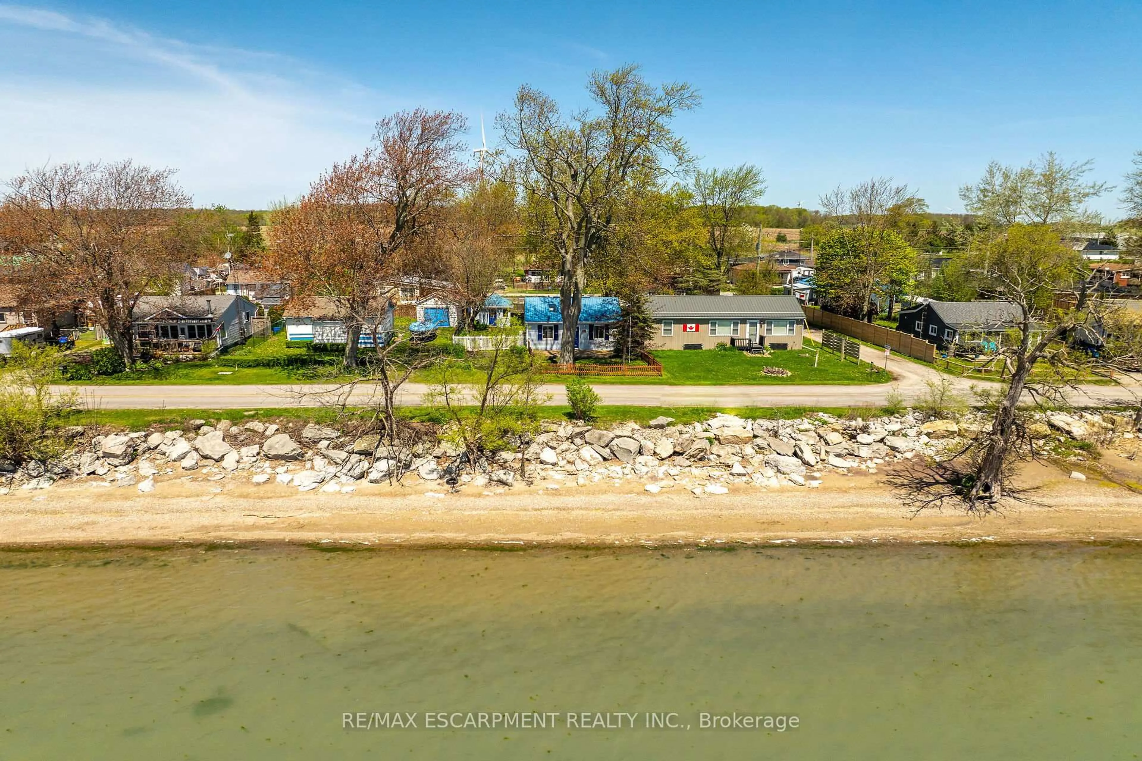 A pic from outside/outdoor area/front of a property/back of a property/a pic from drone, water/lake/river/ocean view for 713 Lakeshore Rd, Haldimand Ontario N0A 1P0