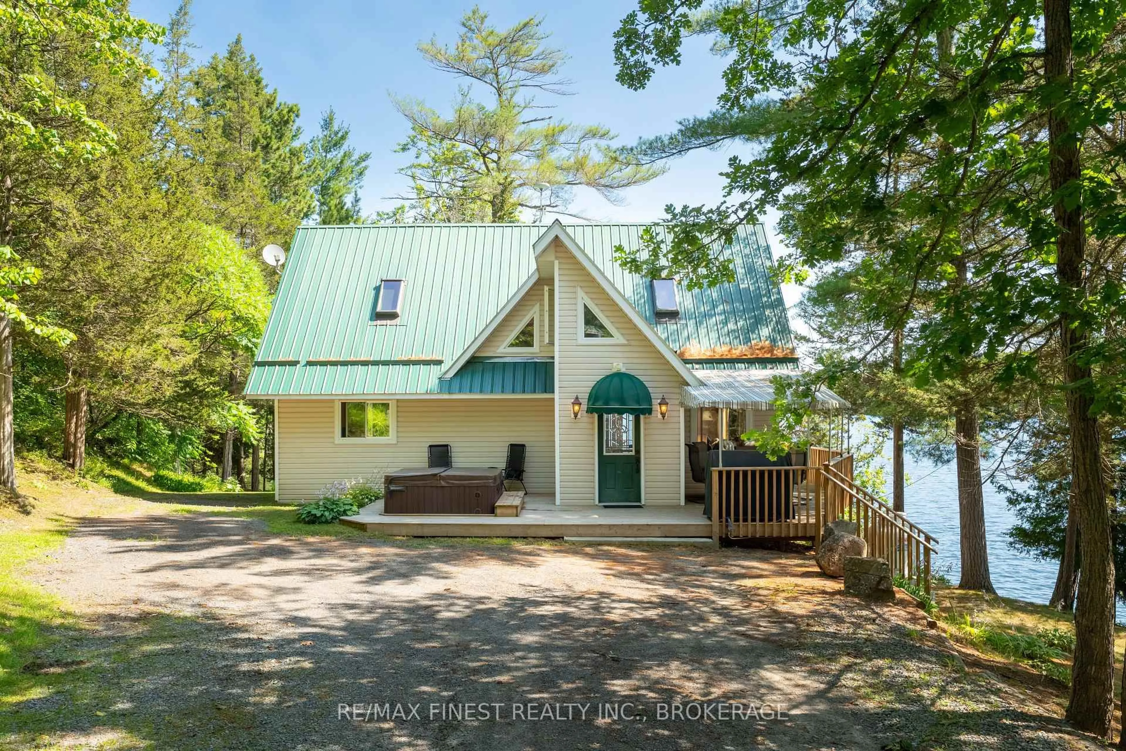 A pic from outside/outdoor area/front of a property/back of a property/a pic from drone, water/lake/river/ocean view for 1076 Chester Lane, Hartington Ontario K0H 1W0