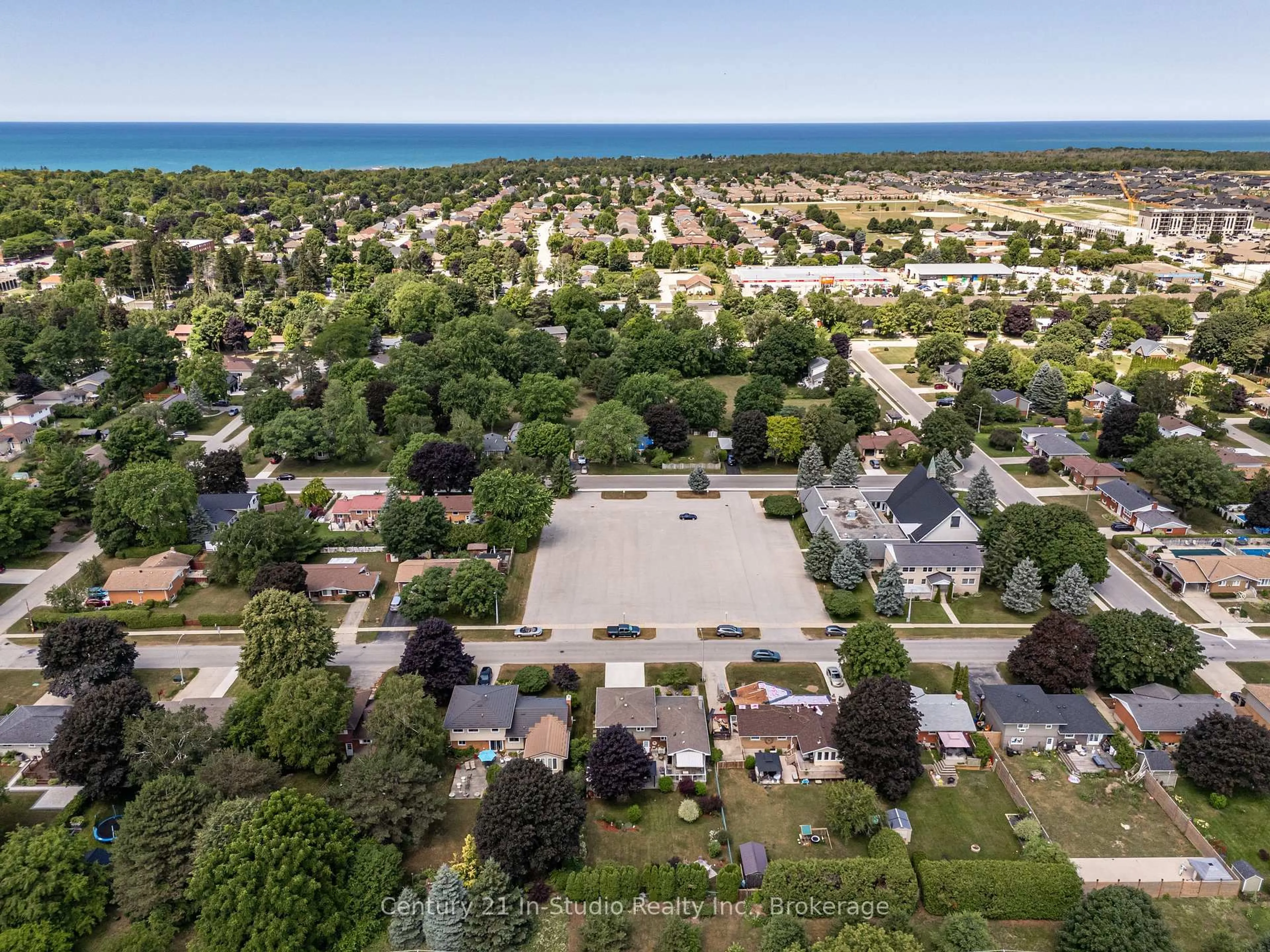 A pic from outside/outdoor area/front of a property/back of a property/a pic from drone, street for 899 Wellington St, Saugeen Shores Ontario N0H 2C3