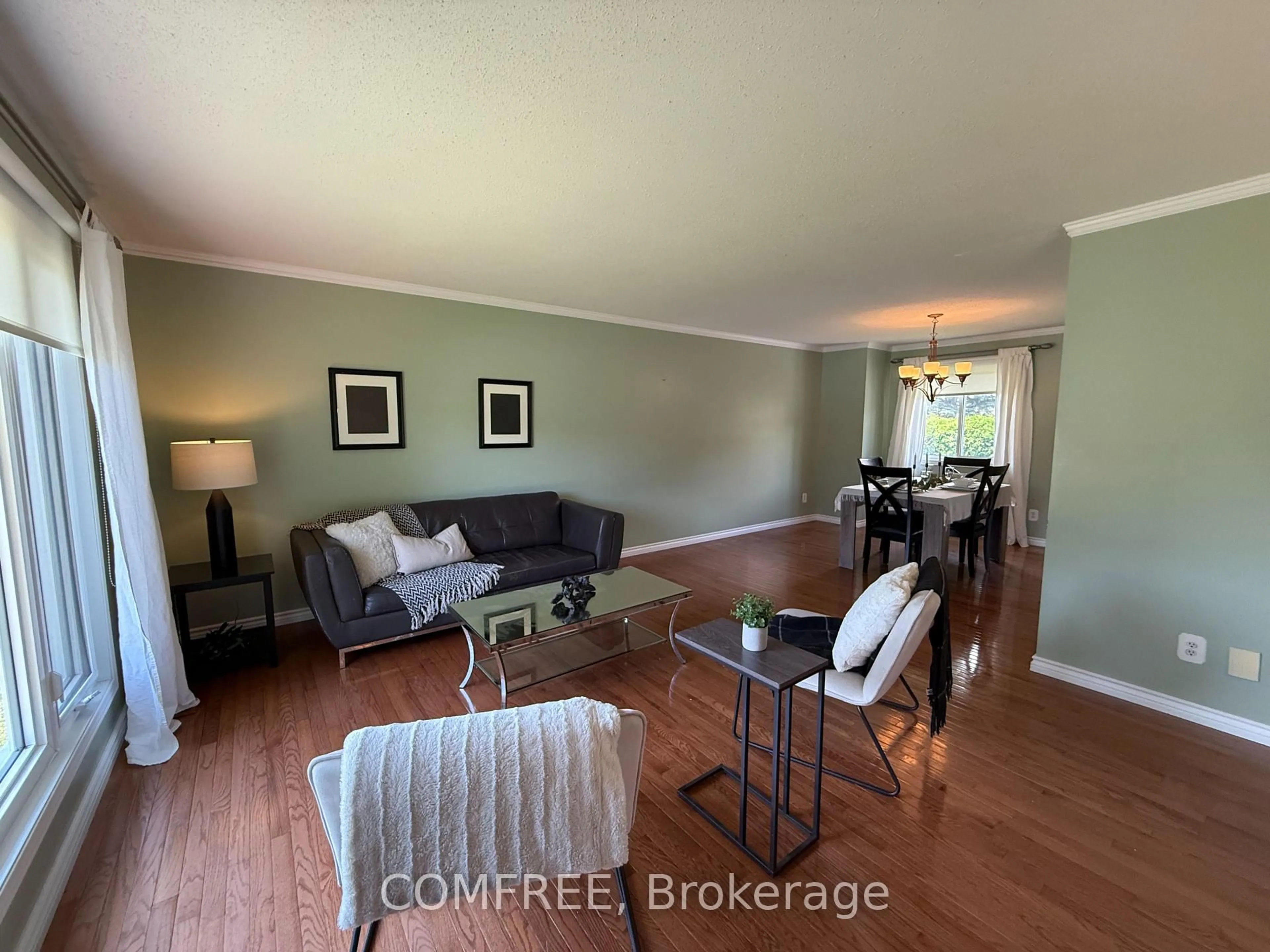 Living room with furniture, wood/laminate floor for 64 Menard St, Russell Ontario K0A 1W1