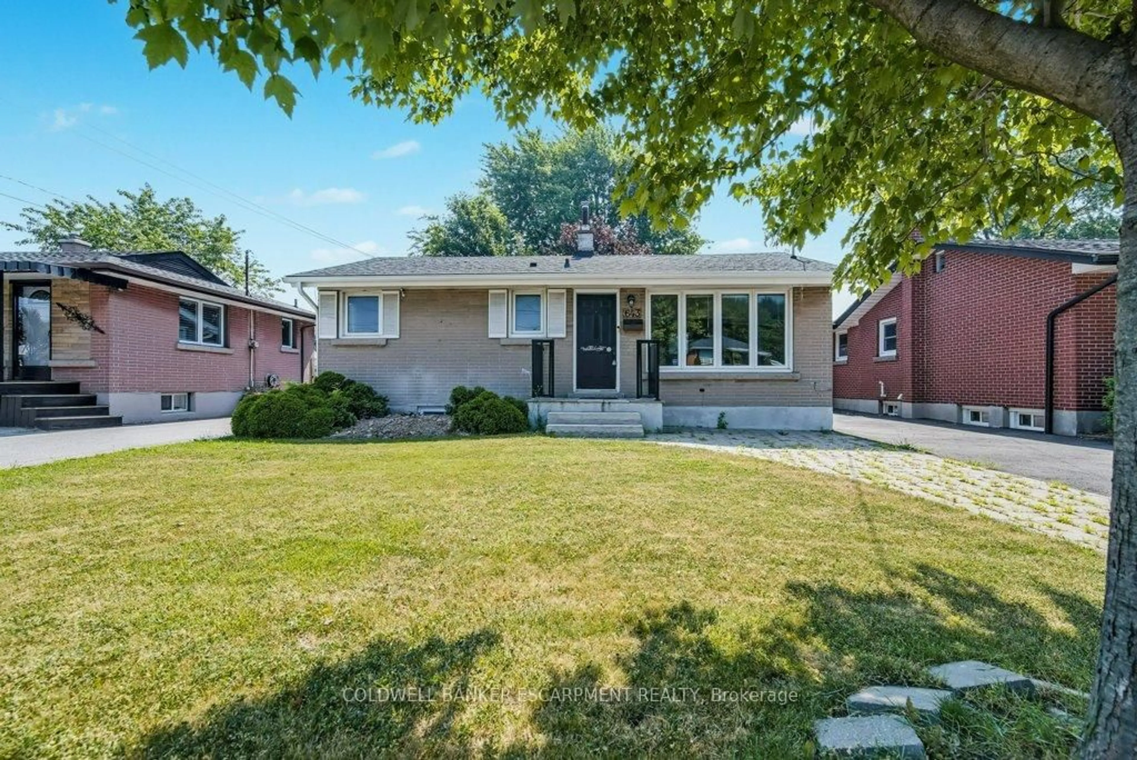 Home with brick exterior material, street for 643 Upper Ottawa St, Hamilton Ontario L8T 3T4
