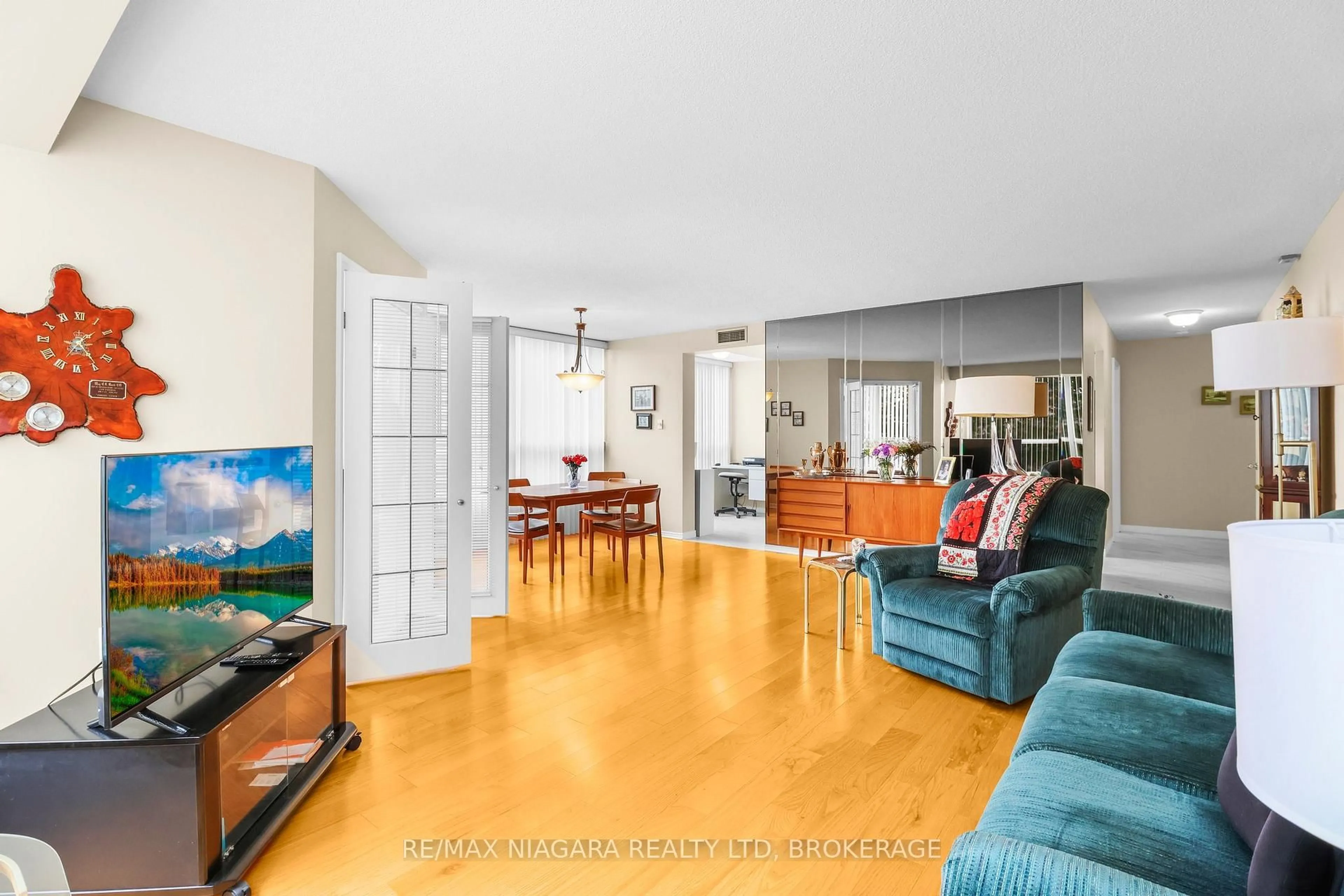 Living room with furniture, unknown for 5100 Dorchester Rd #303, Niagara Falls Ontario L2E 7H4