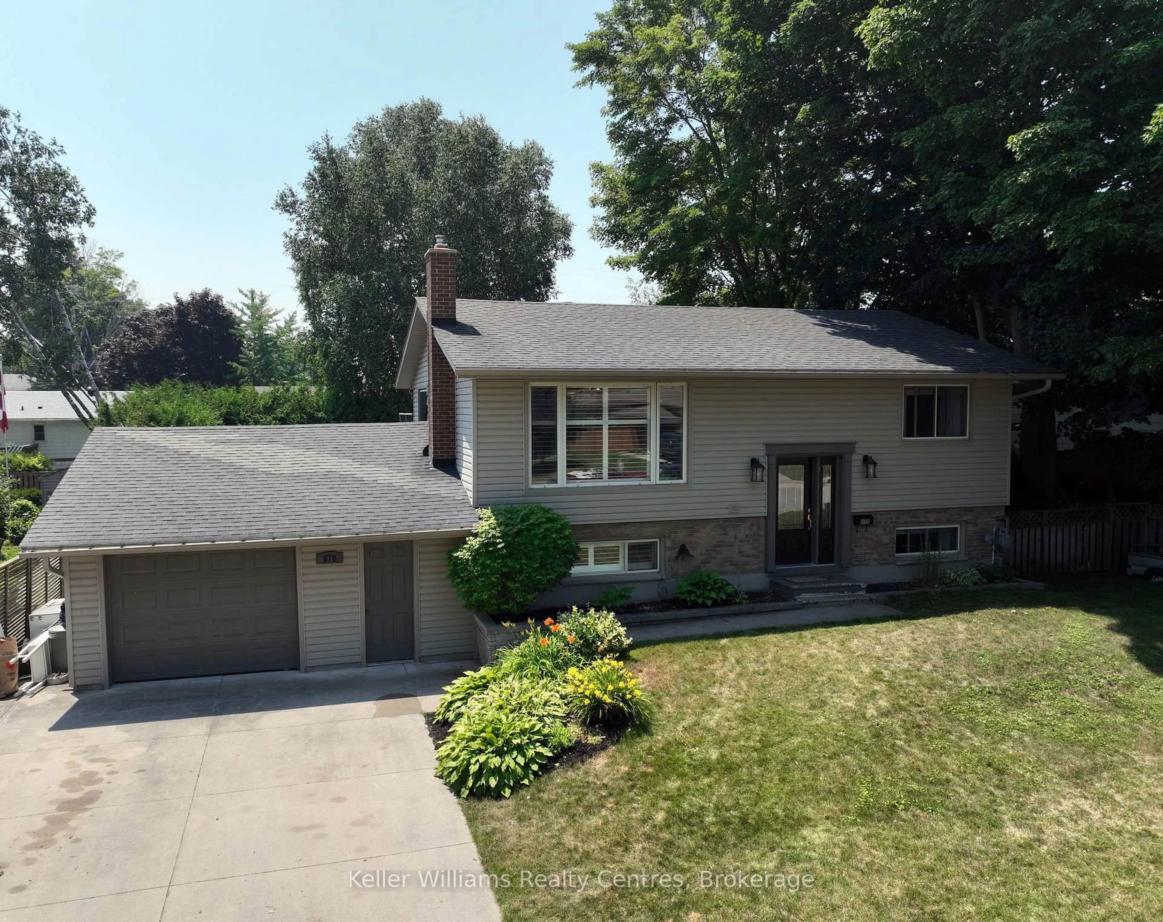Home with vinyl exterior material, street for 678 Orchard Dr, Saugeen Shores Ontario N0H 2C3