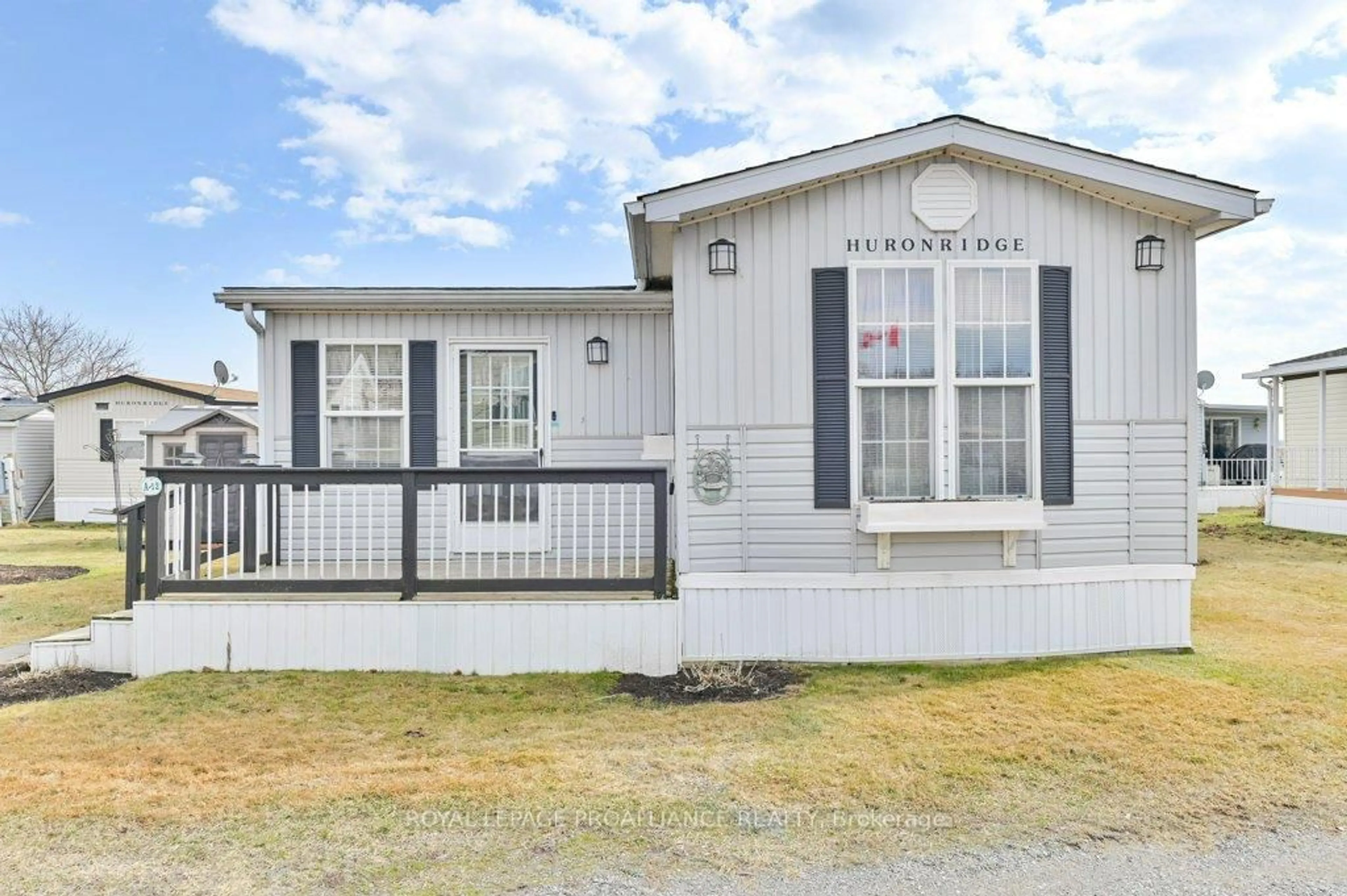 Home with vinyl exterior material, street for 153 County Road 27 #A12, Prince Edward County Ontario K0K 1T0