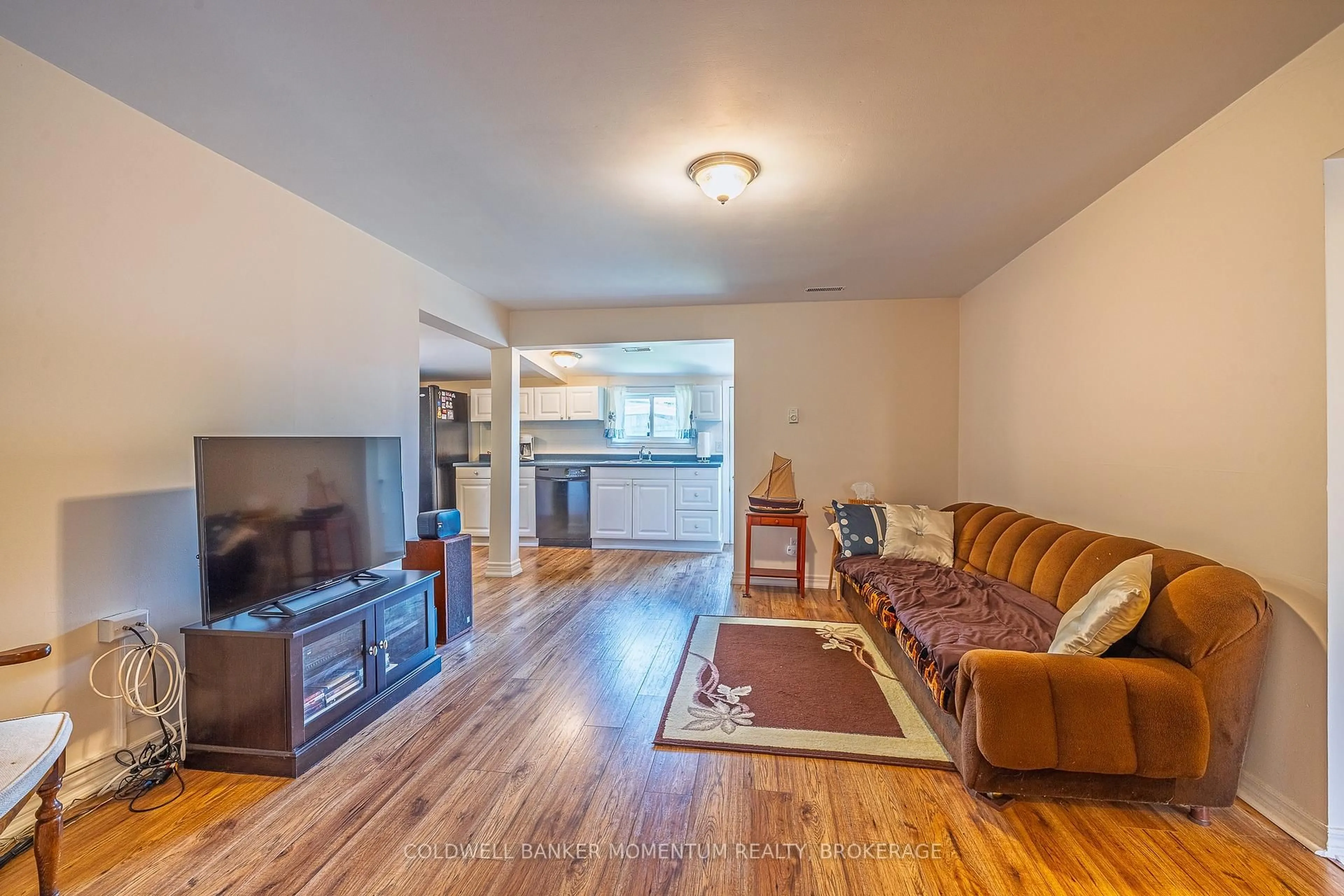Living room with furniture, wood/laminate floor for 380 Washington Rd, Fort Erie Ontario L2A 4K4