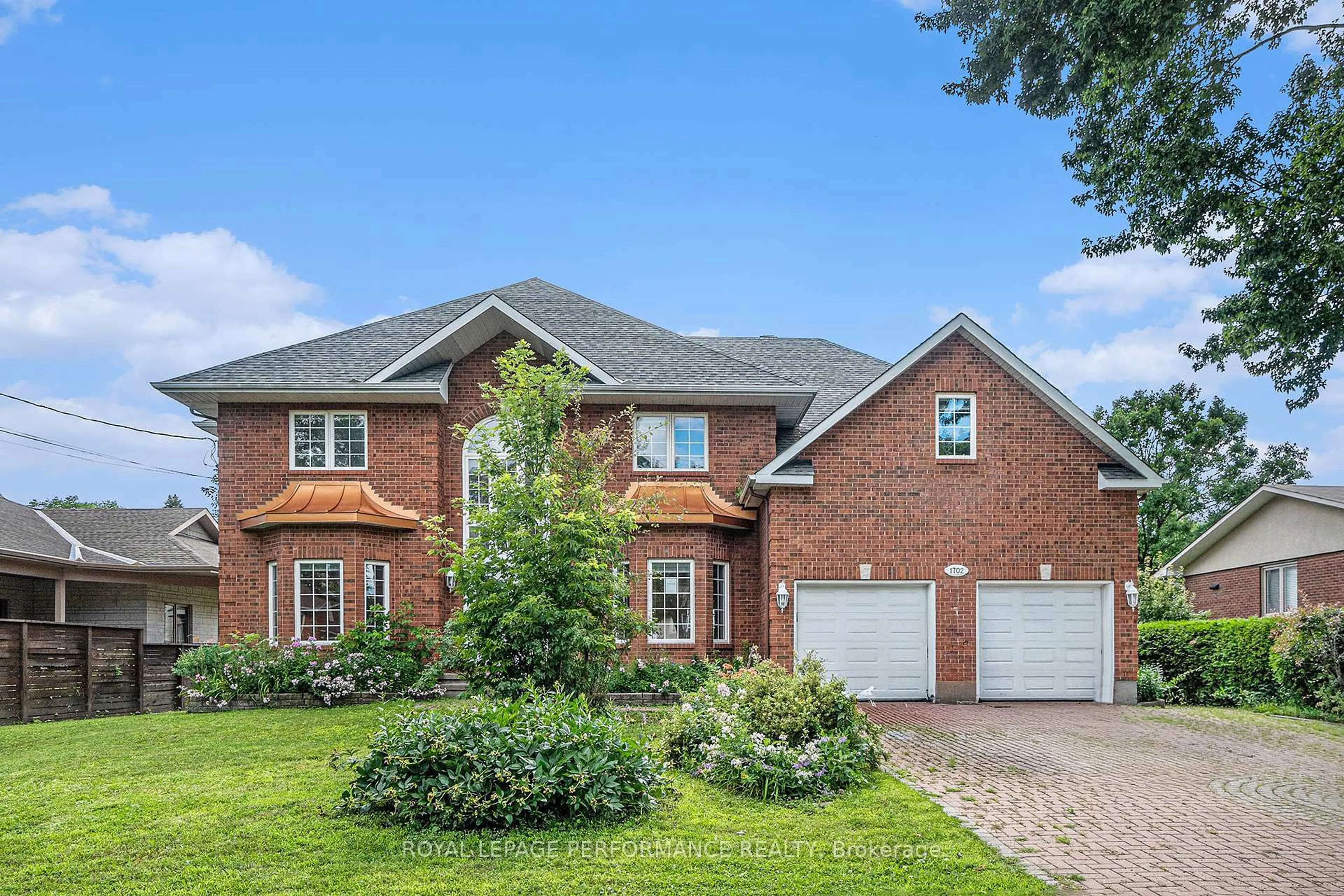 Home with brick exterior material, street for 1702 Ortona Ave, Ottawa Ontario K2C 1W7