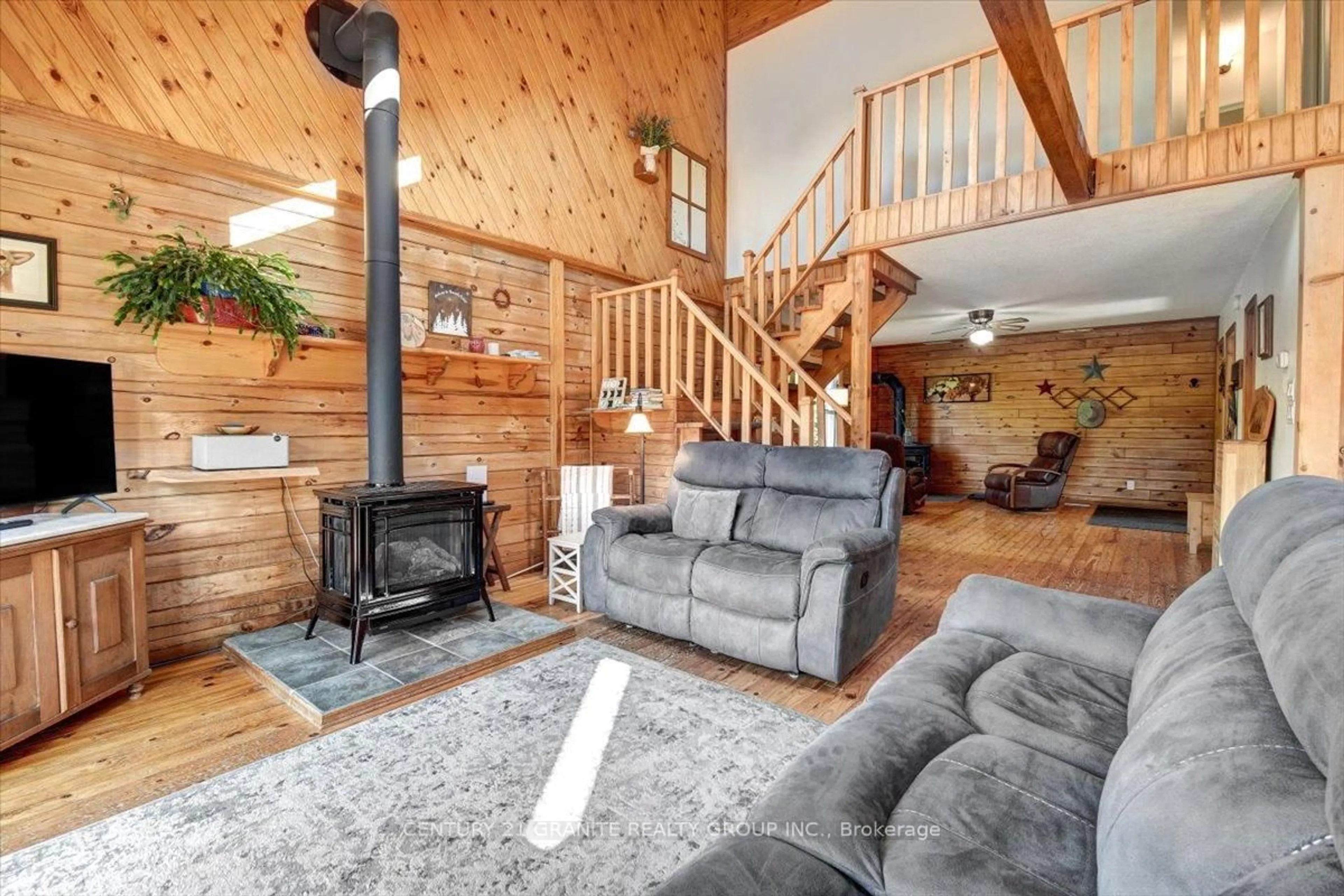 Living room with furniture, wood/laminate floor for 842 Upper Turriff Rd, Bancroft Ontario K0L 1C0