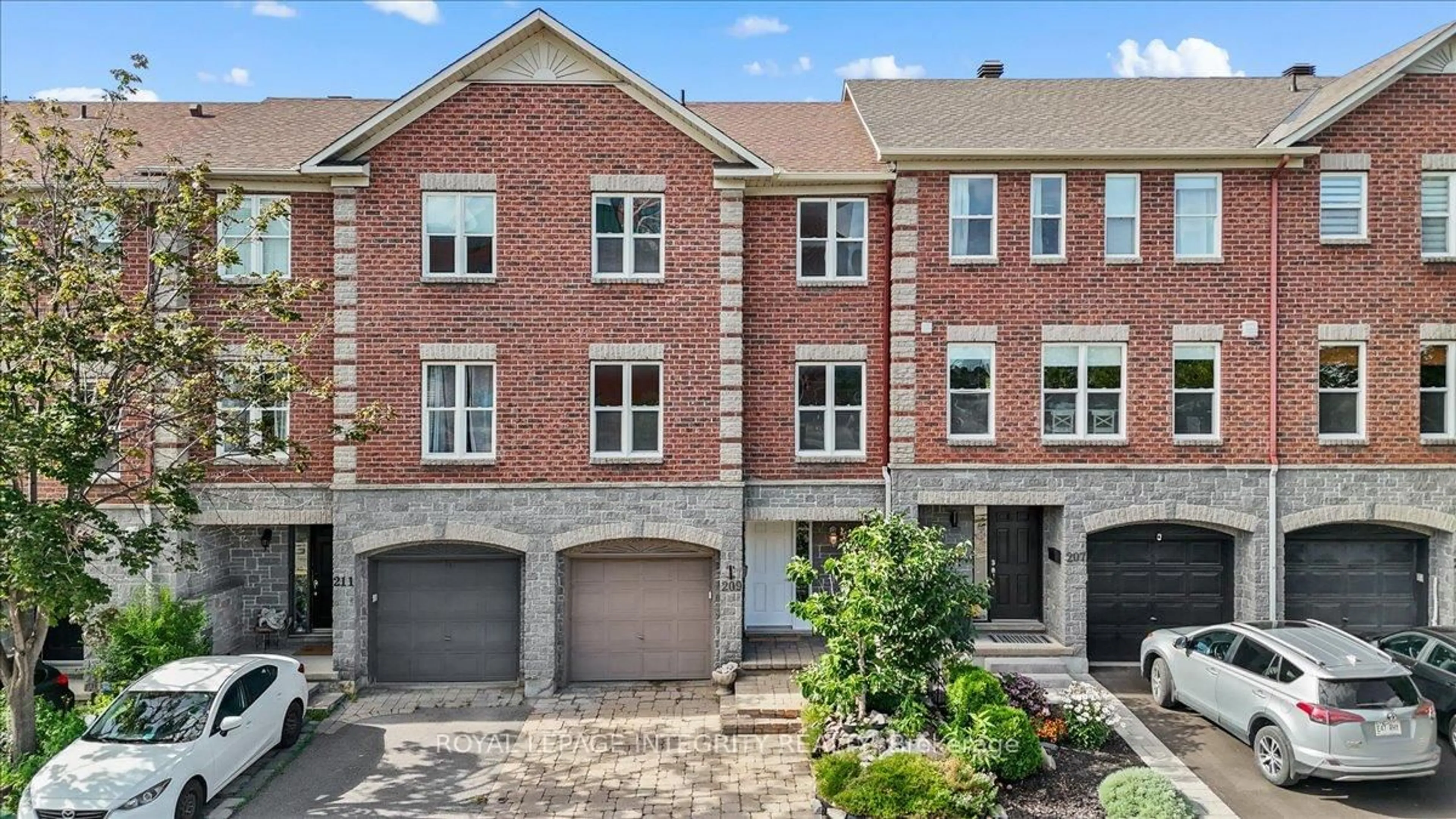 Home with brick exterior material, street for 209 Arcola Private, Ottawa Ontario K1K 4X1