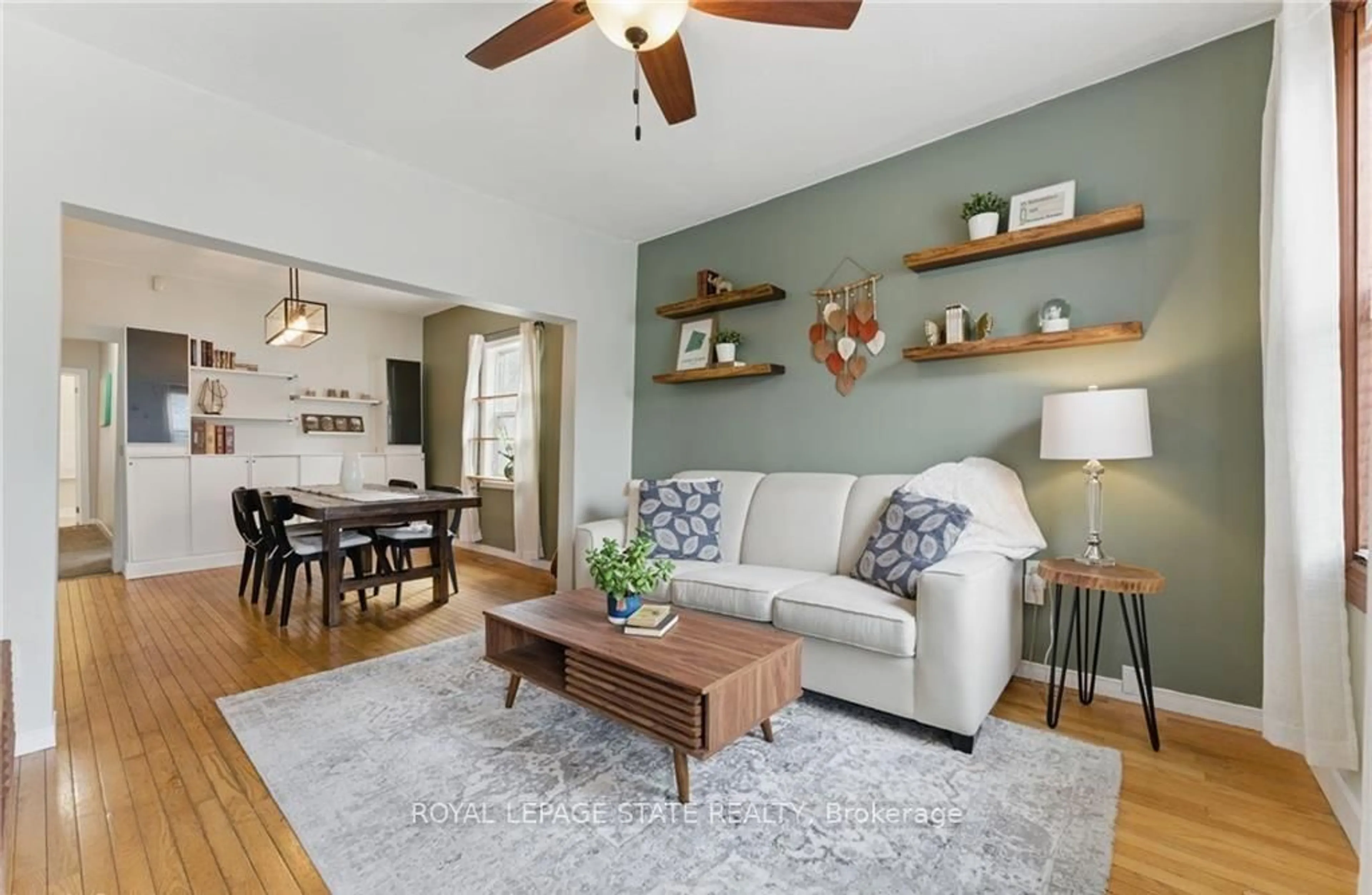 Living room with furniture, wood/laminate floor for 91 Aurora St, Hamilton Ontario L8N 2P6