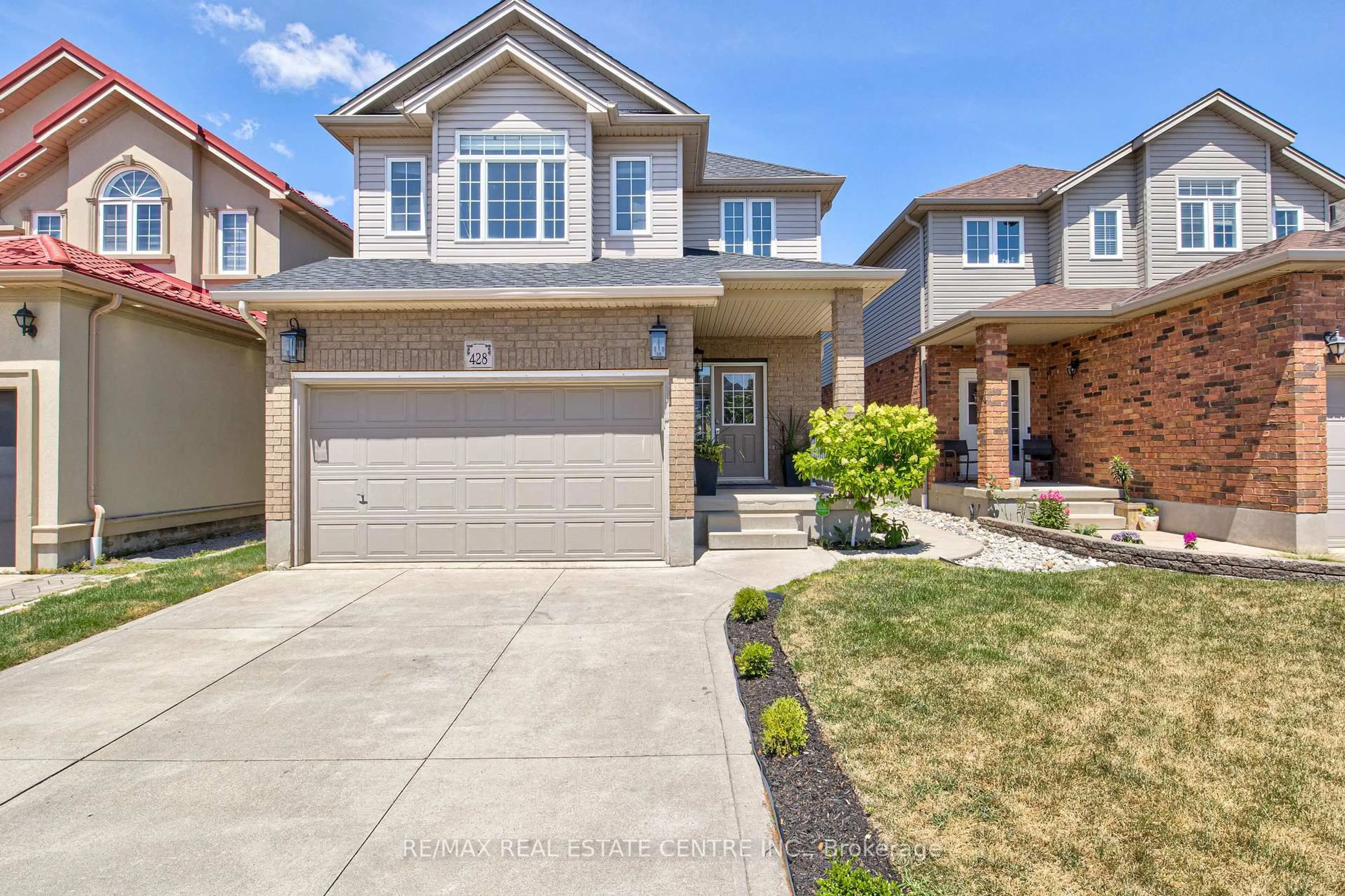Home with brick exterior material, street for 428 Thomas Slee Dr, Kitchener Ontario N2P 2X6