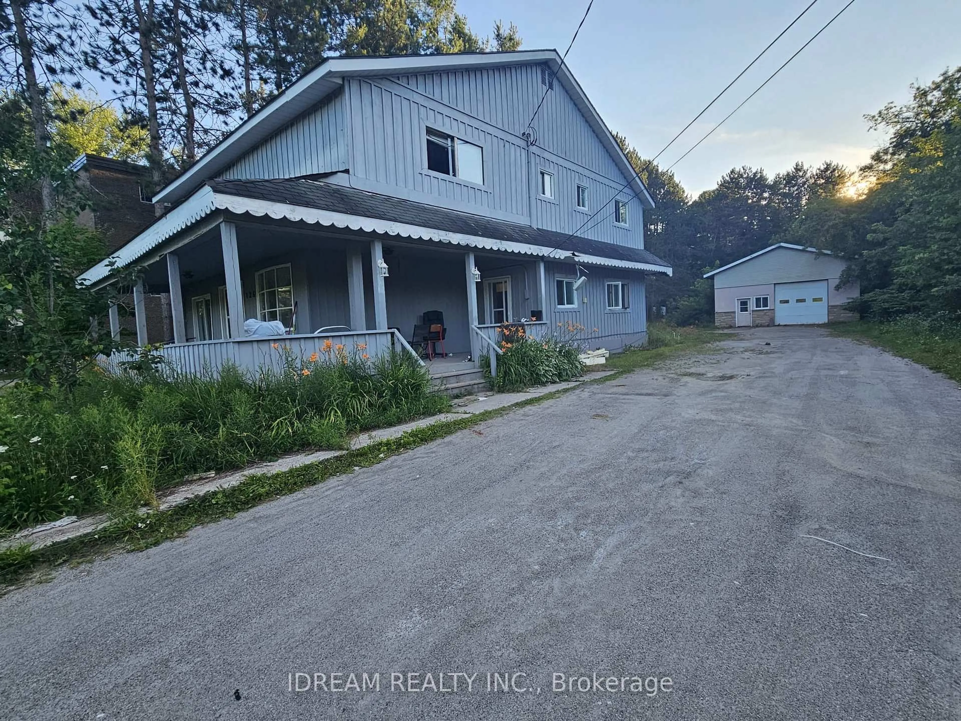 A pic from outside/outdoor area/front of a property/back of a property/a pic from drone, street for 126 River Rd, Bracebridge Ontario P1L 1L8