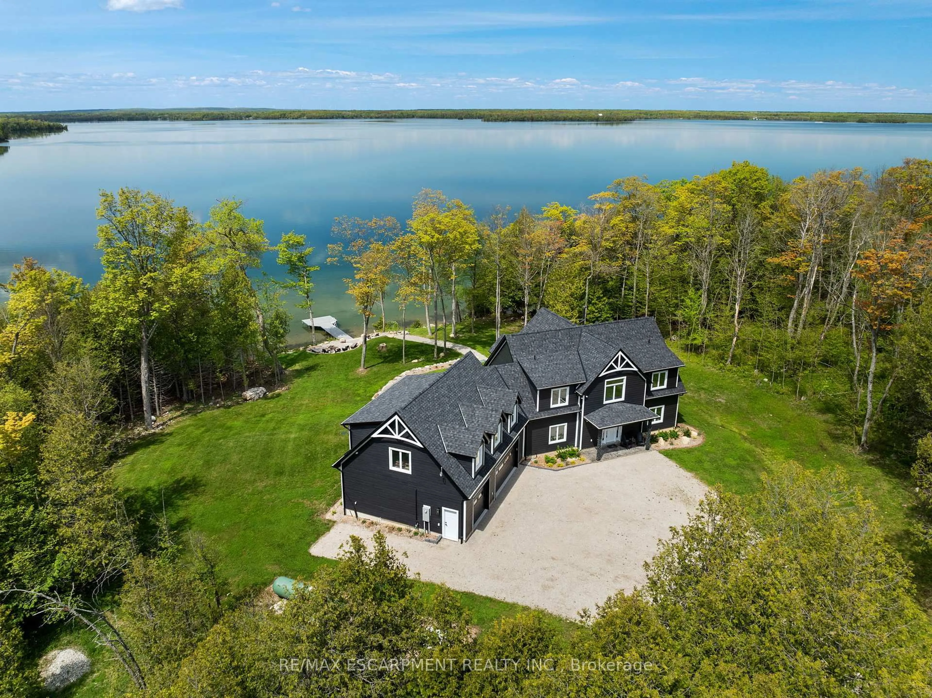 A pic from outside/outdoor area/front of a property/back of a property/a pic from drone, water/lake/river/ocean view for 76B JOHNSTON Rd, Central Manitoulin Ontario P0P 1S0