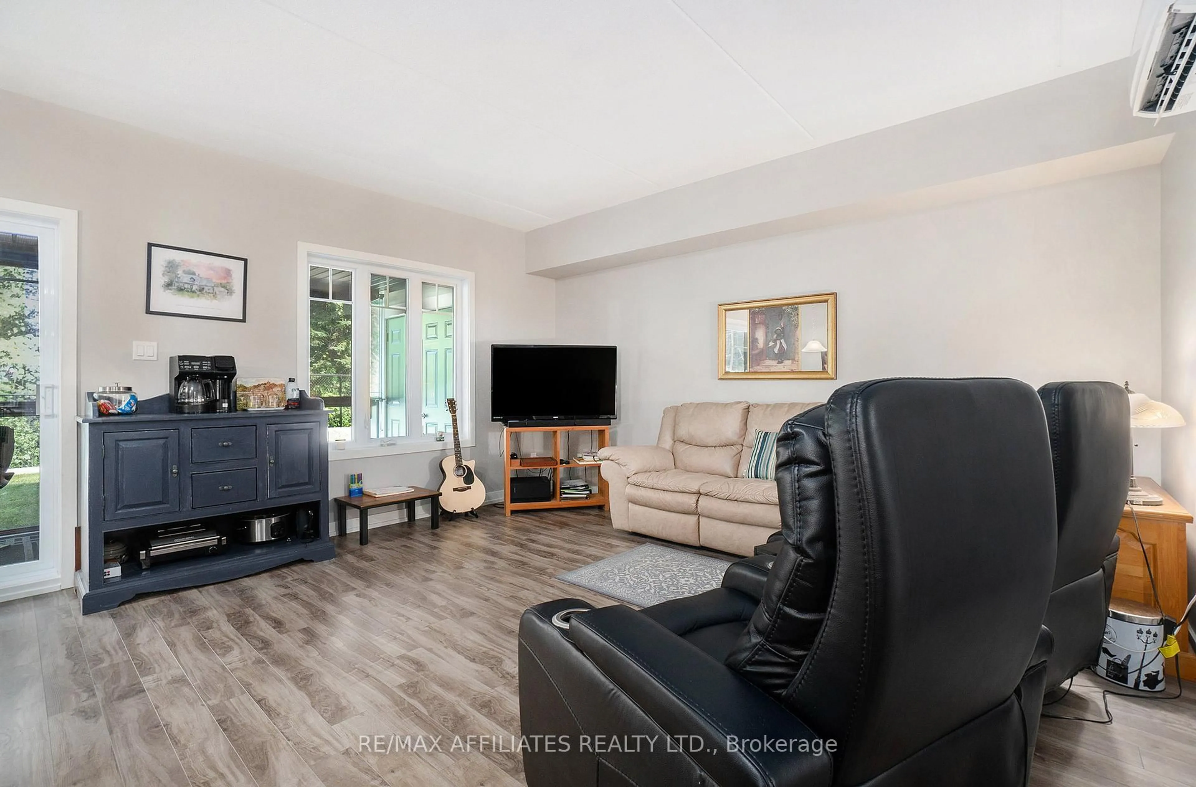 Living room with furniture, wood/laminate floor for 99 St-Moritz Tr #401, Russell Ontario K0A 1W0