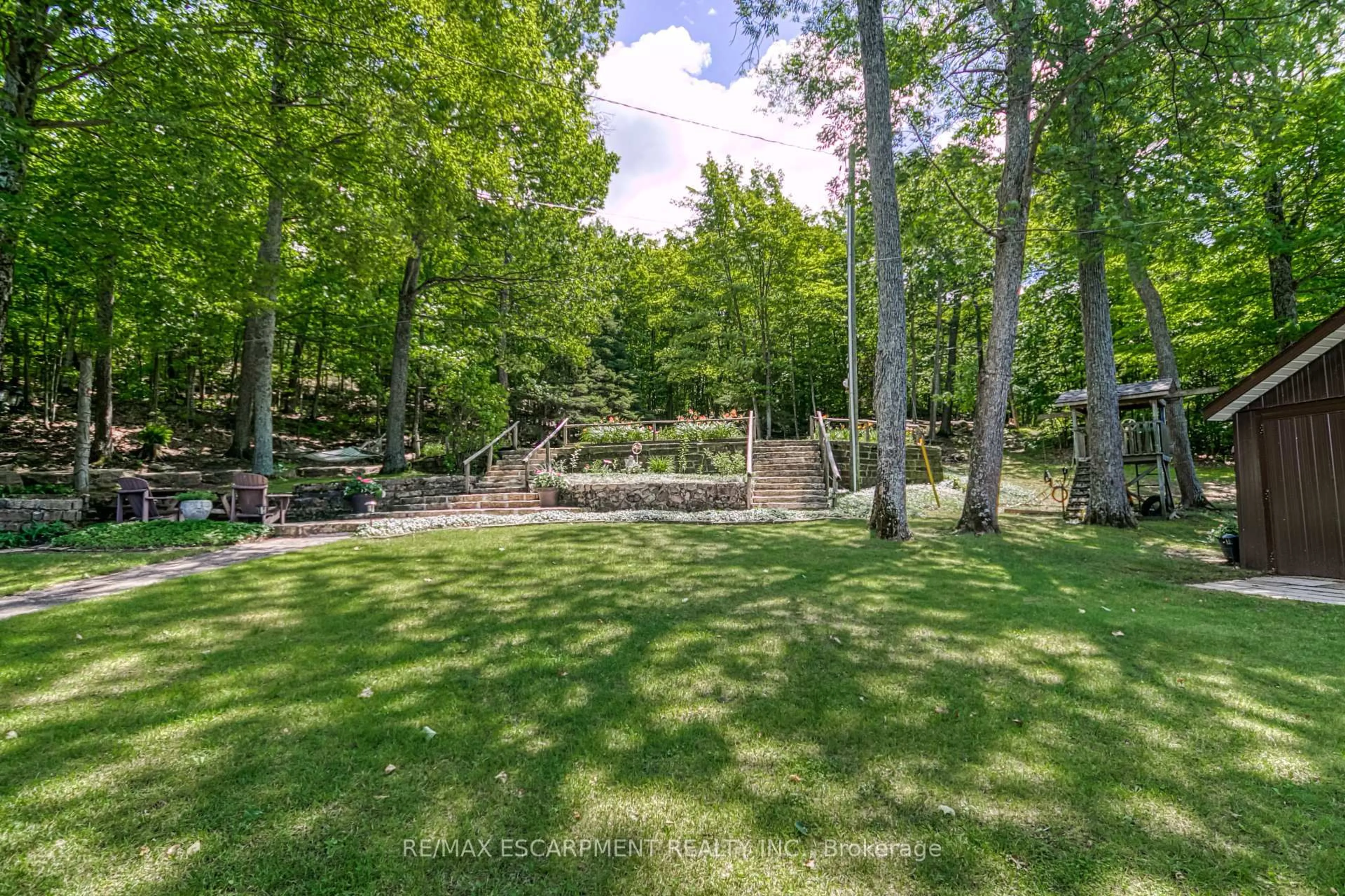 Patio, forest/trees view for 199 Trillium Tr, Central Manitoulin Ontario P0P 2C0