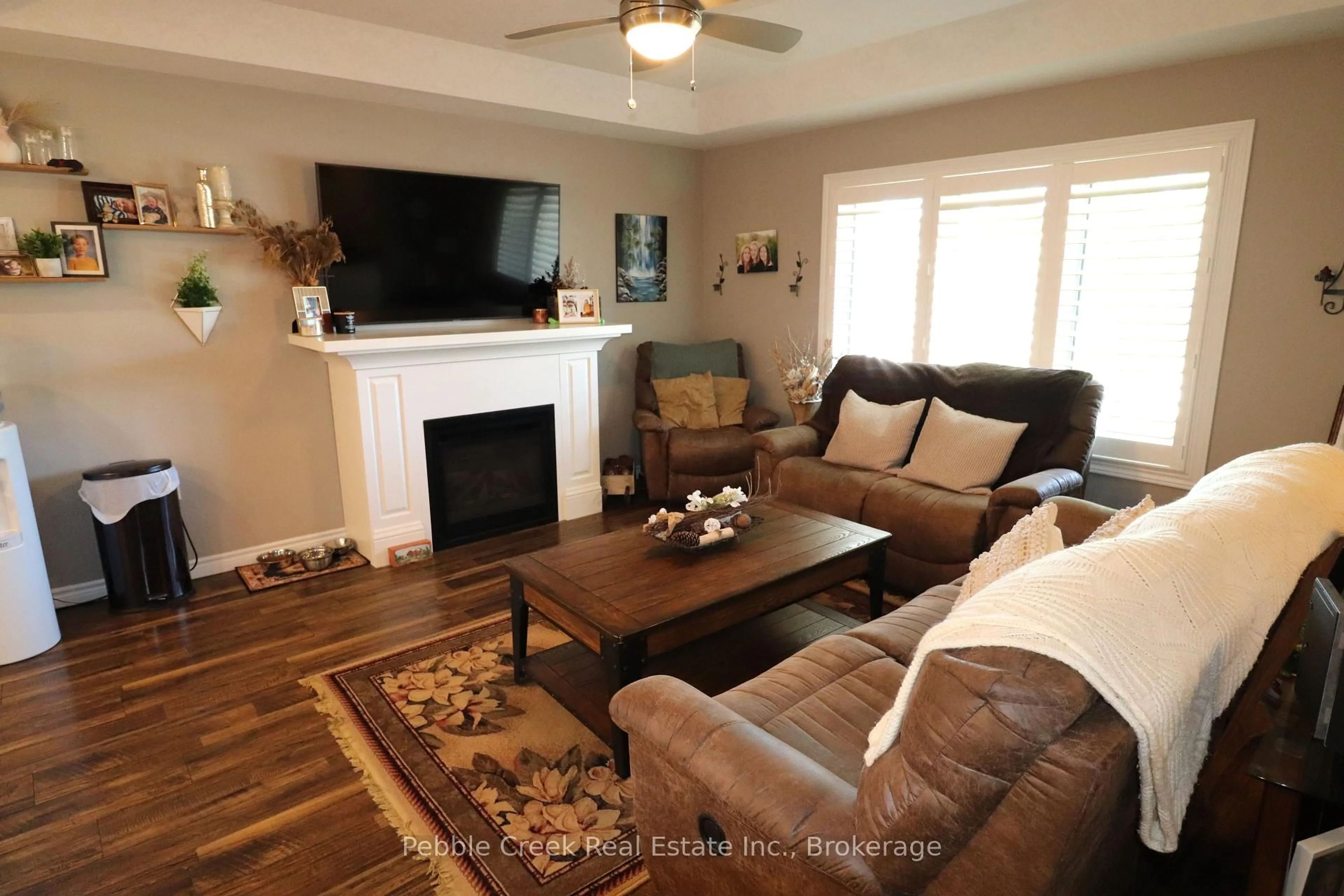 Living room with furniture, wood/laminate floor for 24 Huron Heights Dr, Ashfield-Colborne-Wawanosh Ontario N7A 0B1