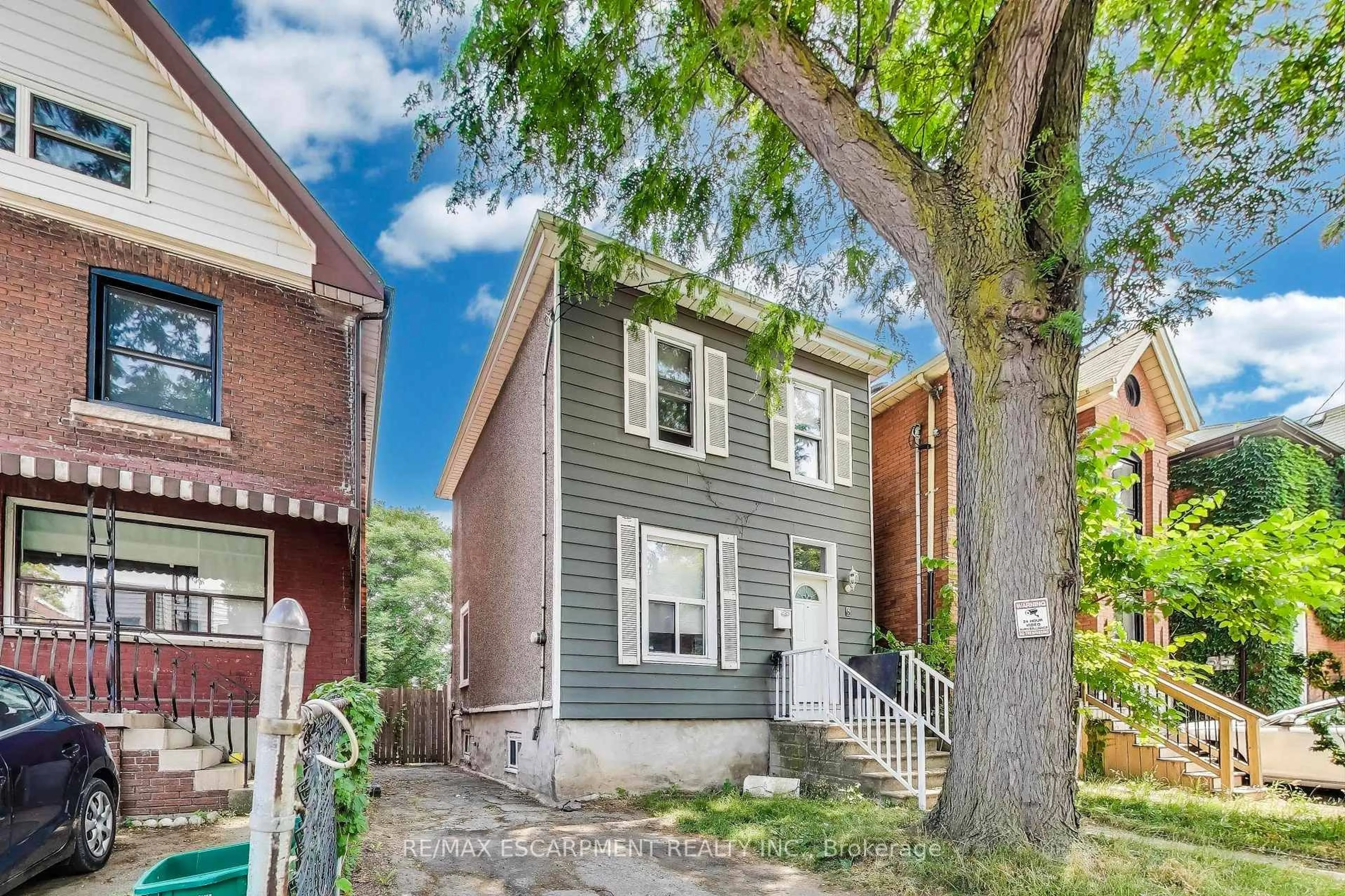 Home with brick exterior material, street for 8 Madison Ave, Hamilton Ontario L8L 5Y3