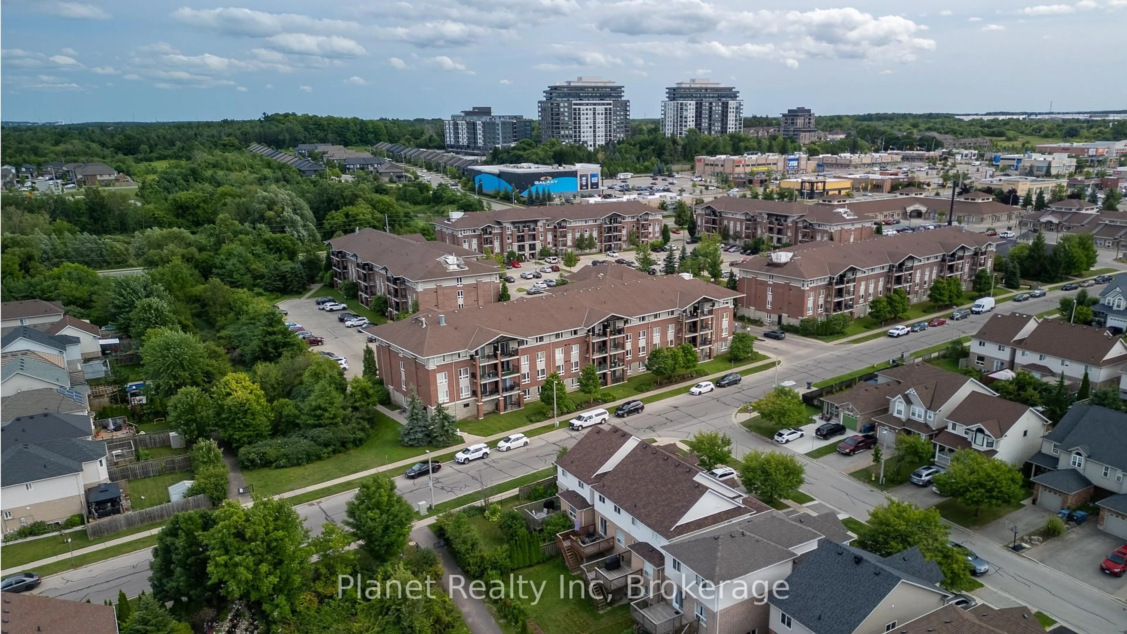A pic from outside/outdoor area/front of a property/back of a property/a pic from drone, city buildings view from balcony for 39 Goodwin Dr #110, Guelph Ontario N1L 0E5