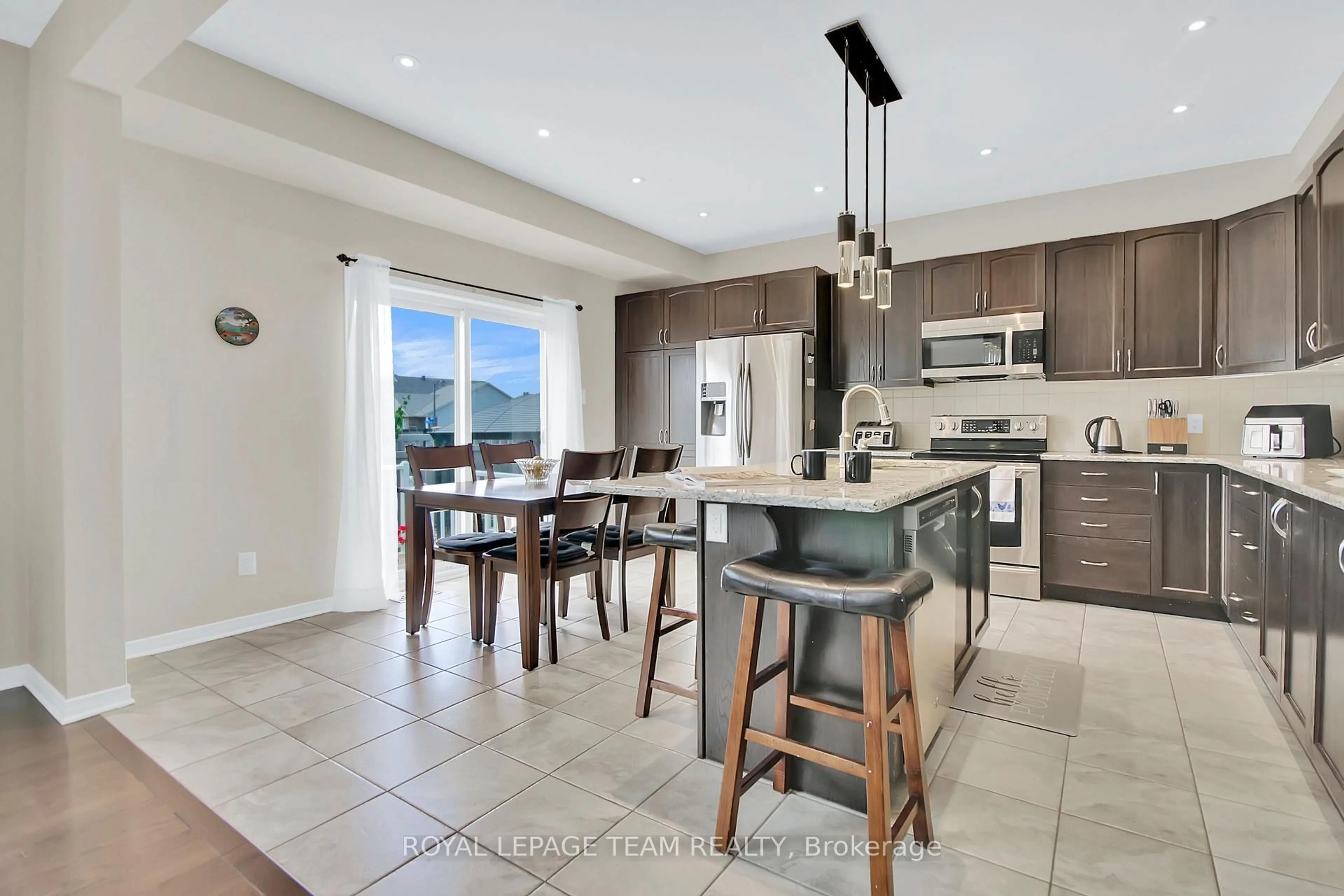 Open concept kitchen, ceramic/tile floor for 217 Balikun Hts, Stittsville Ontario K2V 0A6