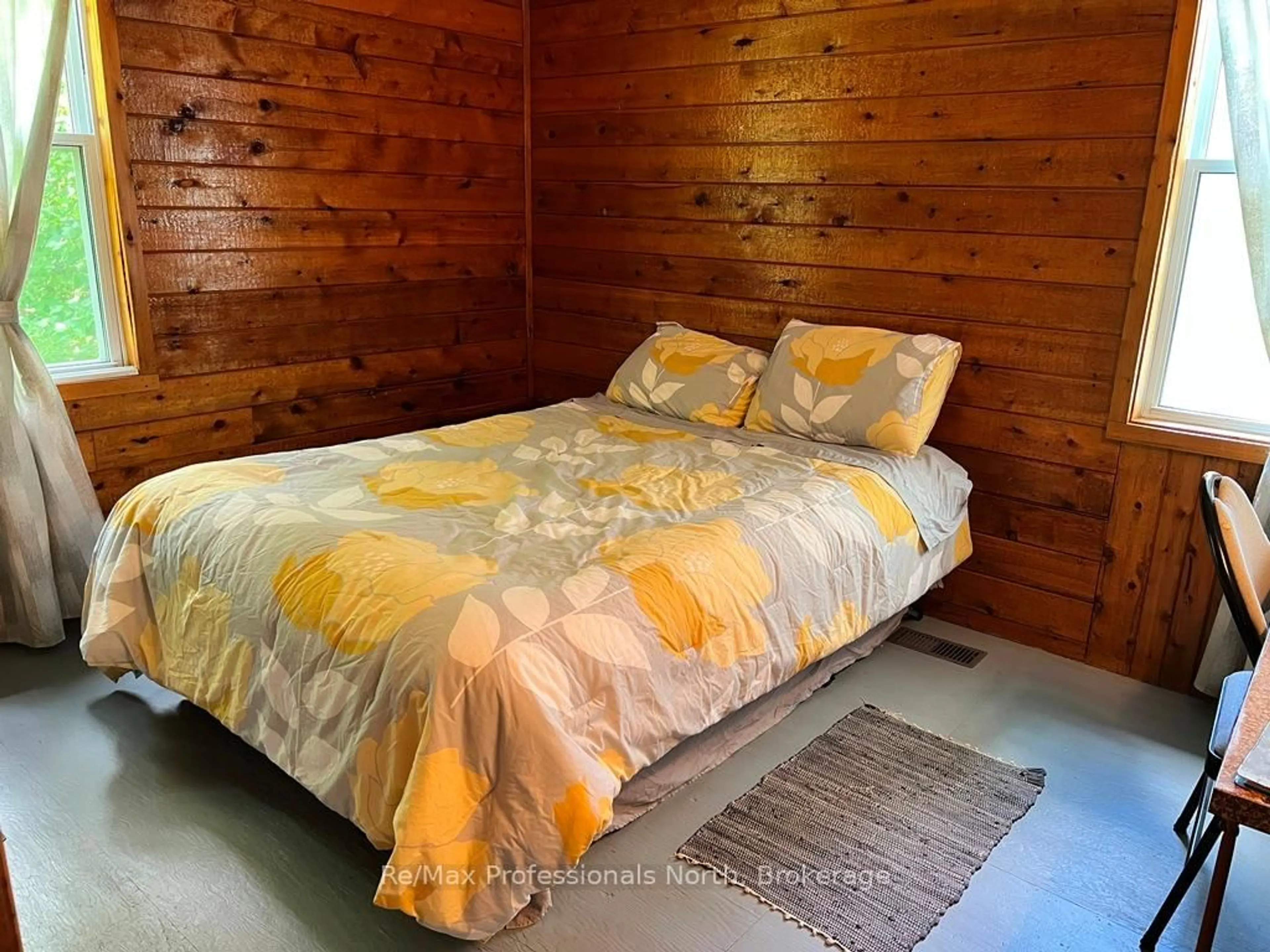 Bedroom with bed, wood/laminate floor for 6189 Loop Rd, Highlands East Ontario K0L 2A0