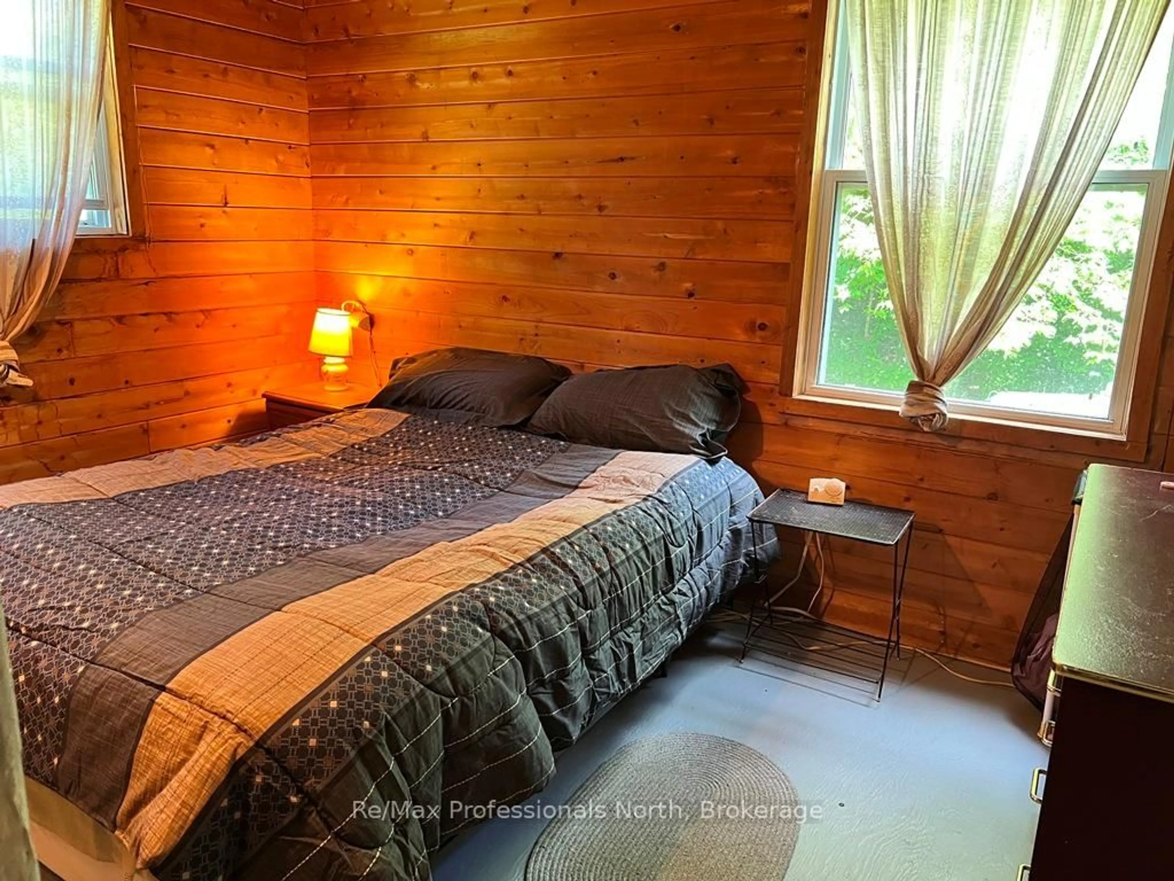 Bedroom with bed, wood/laminate floor for 6189 Loop Rd, Highlands East Ontario K0L 2A0