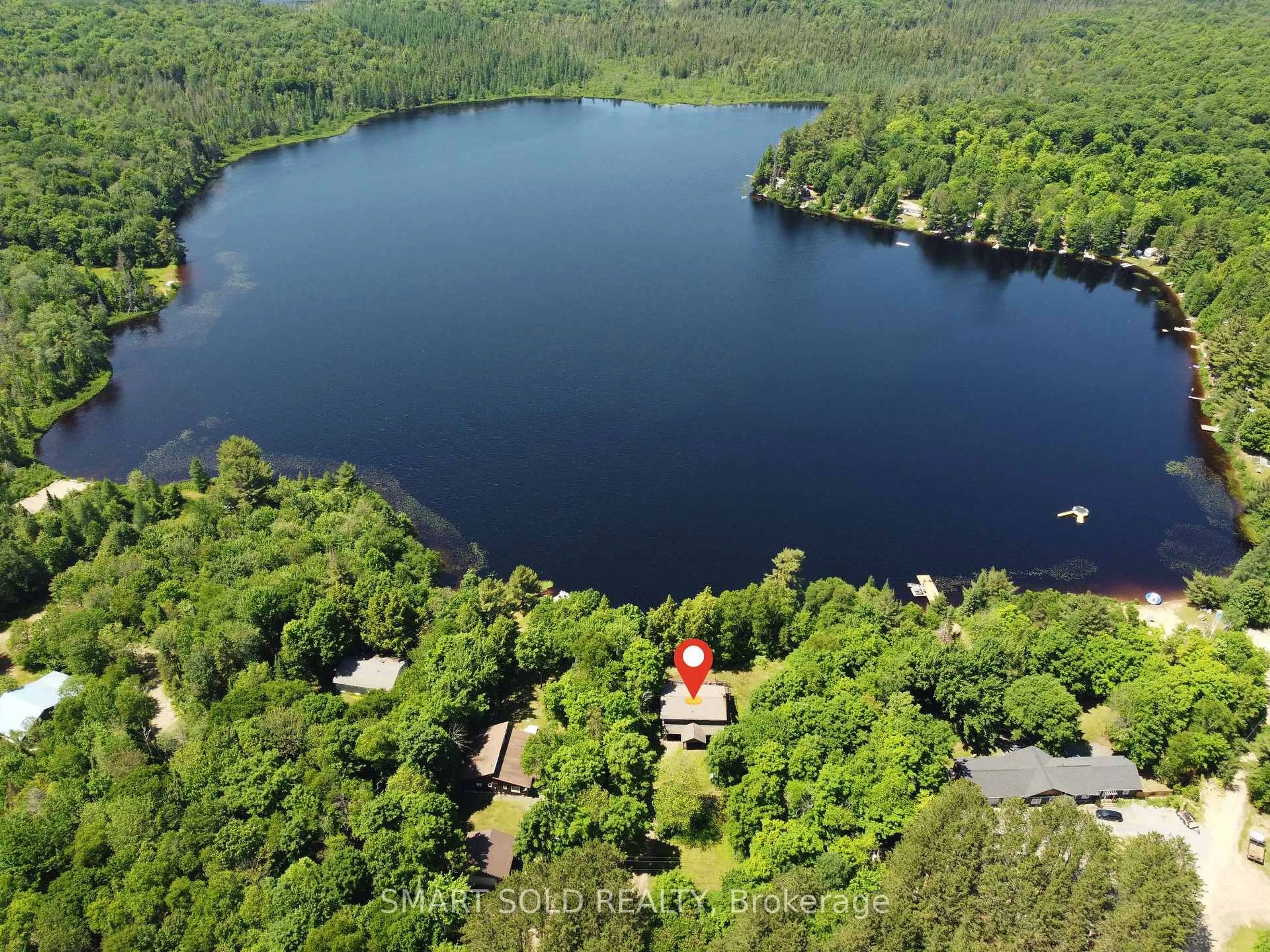 A pic from outside/outdoor area/front of a property/back of a property/a pic from drone, water/lake/river/ocean view for 105 MUSKOKA GLENS COTTAGE Rd, Huntsville Ontario P1H 2N5