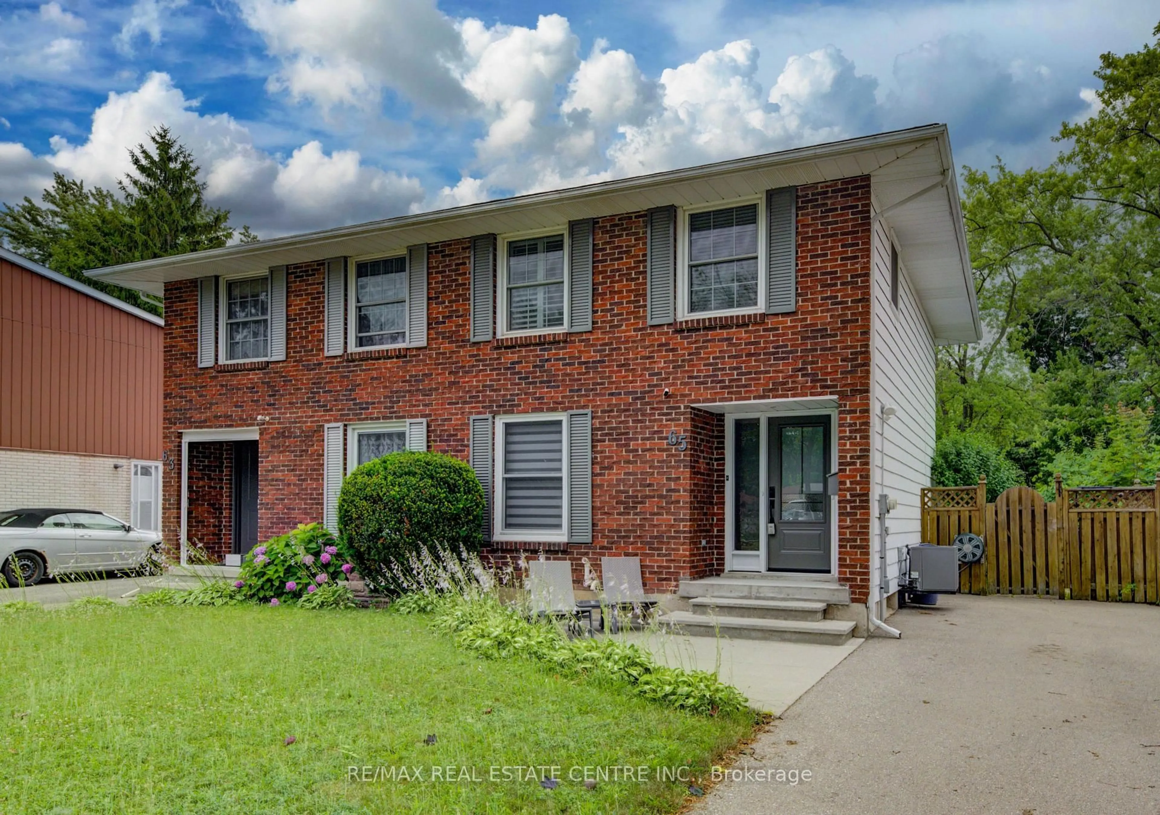 Home with brick exterior material, street for 65 Selkirk Dr, Kitchener Ontario N2E 1M5
