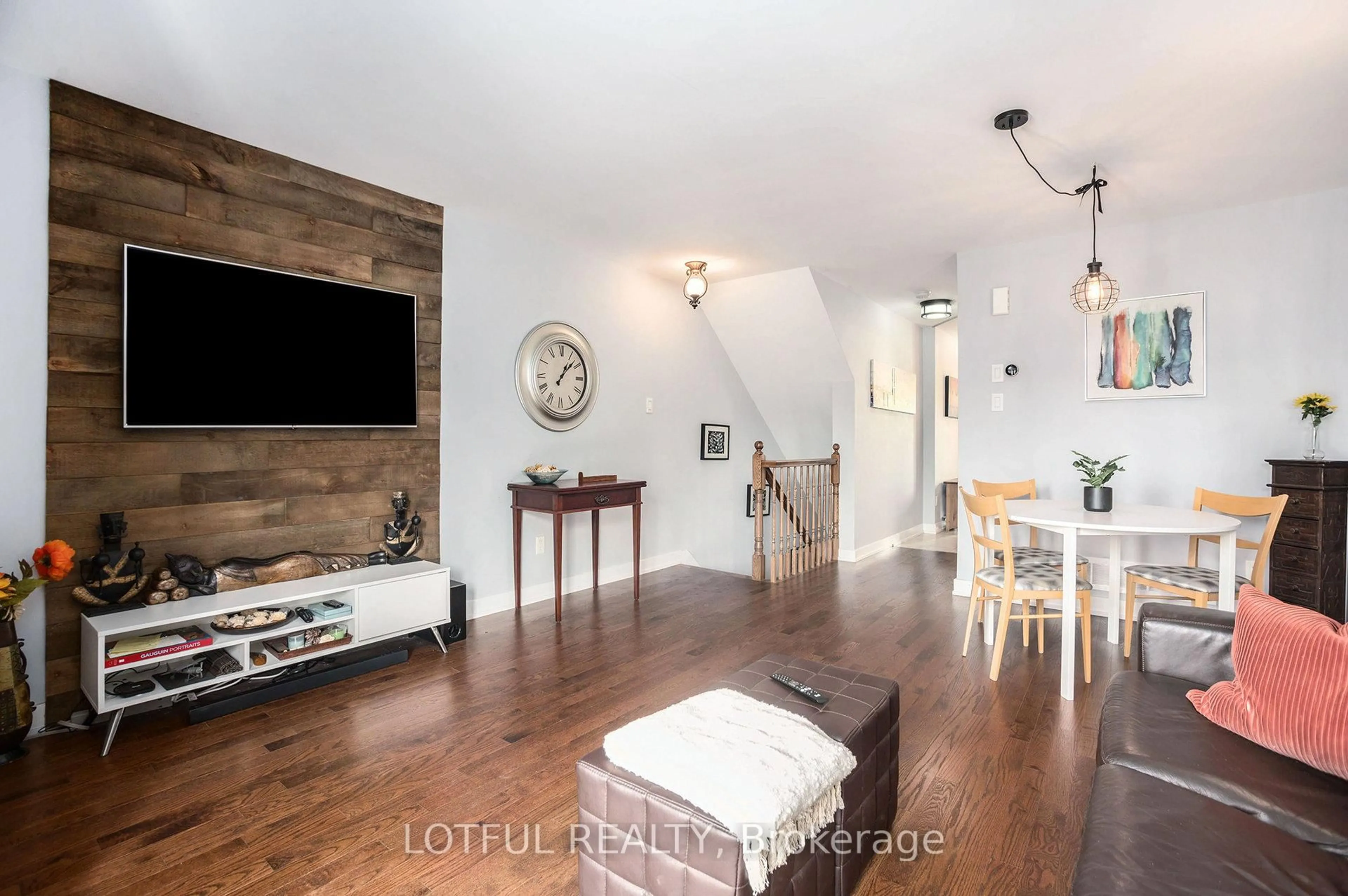 Living room with furniture, wood/laminate floor for 2016 Dorima St #A, Ottawa Ontario K4A 0X5