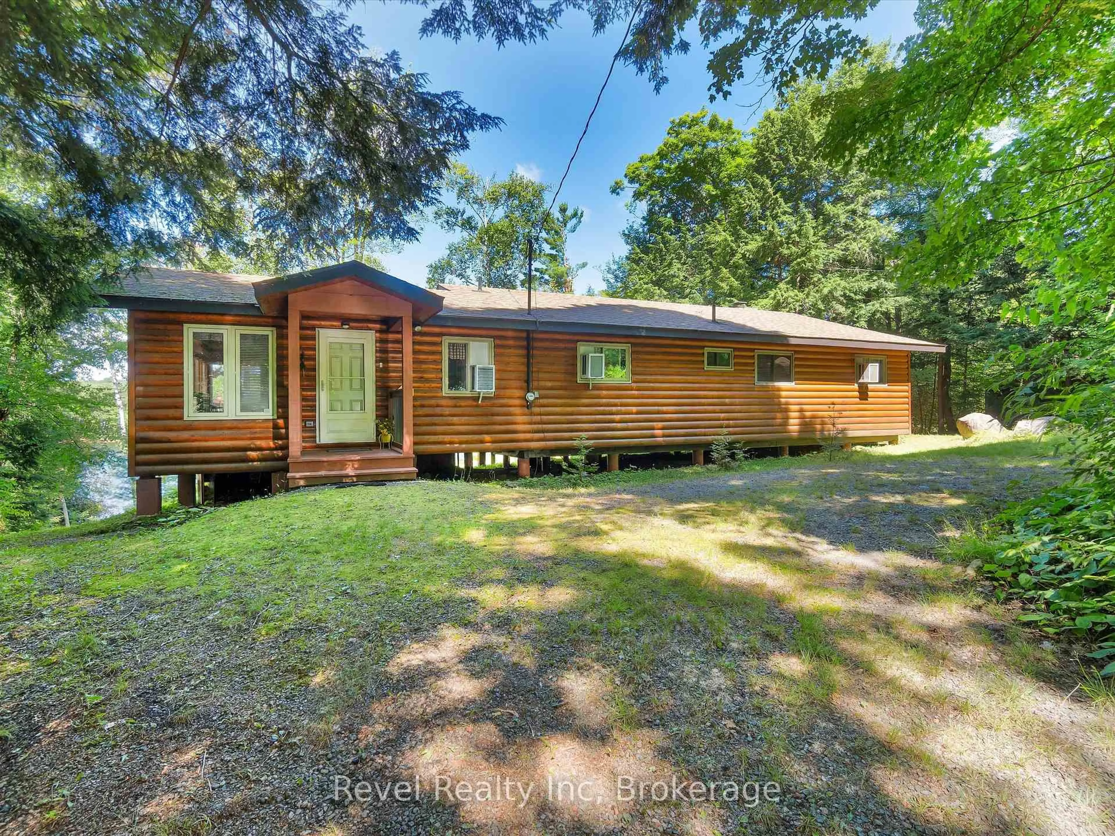 A pic from outside/outdoor area/front of a property/back of a property/a pic from drone, forest/trees view for 1022 Bird Lake Cres, Bracebridge Ontario P1L 1X1