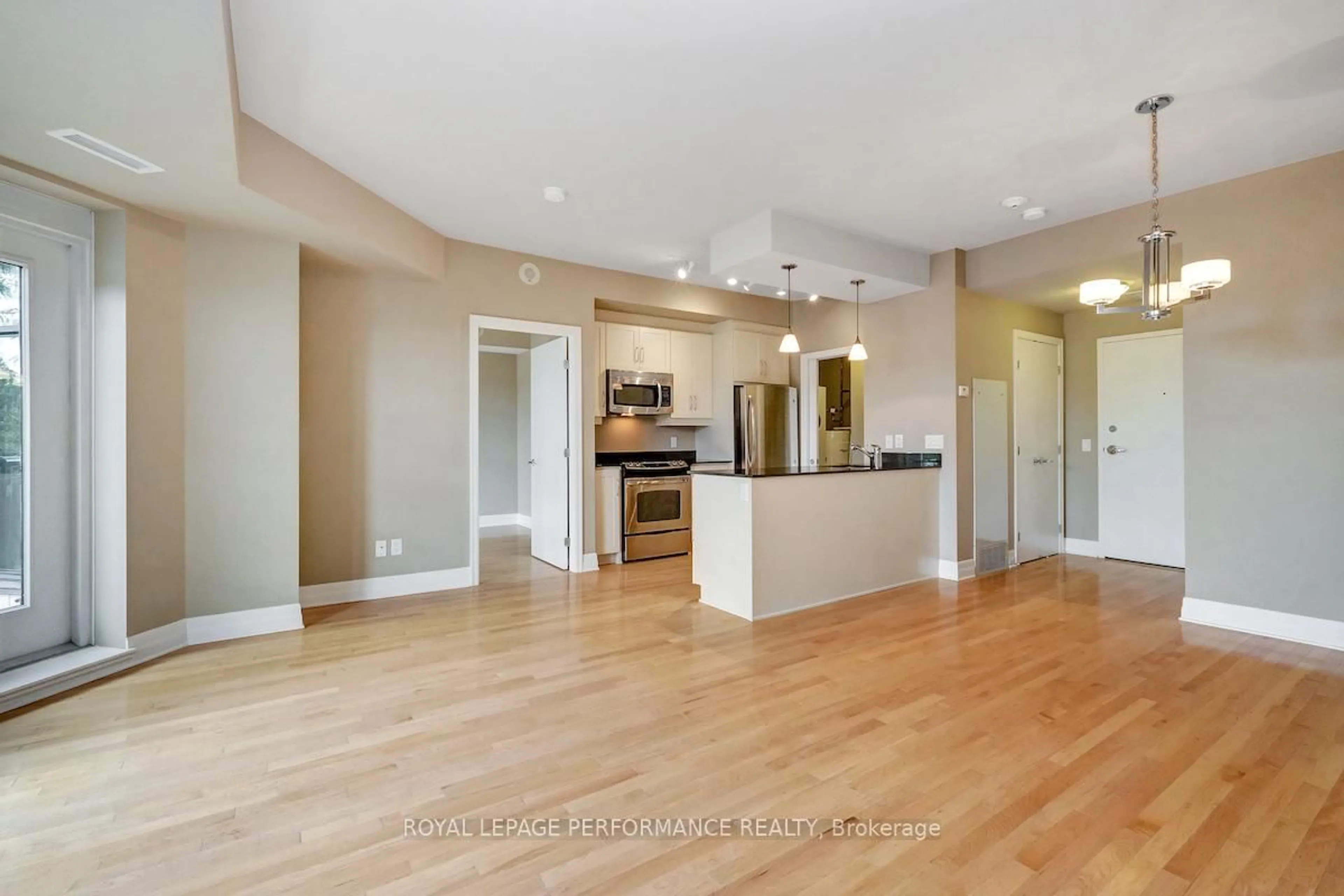 Open concept kitchen, wood/laminate floor for 75 Cleary Ave #207, Ottawa Ontario K2A 1R8