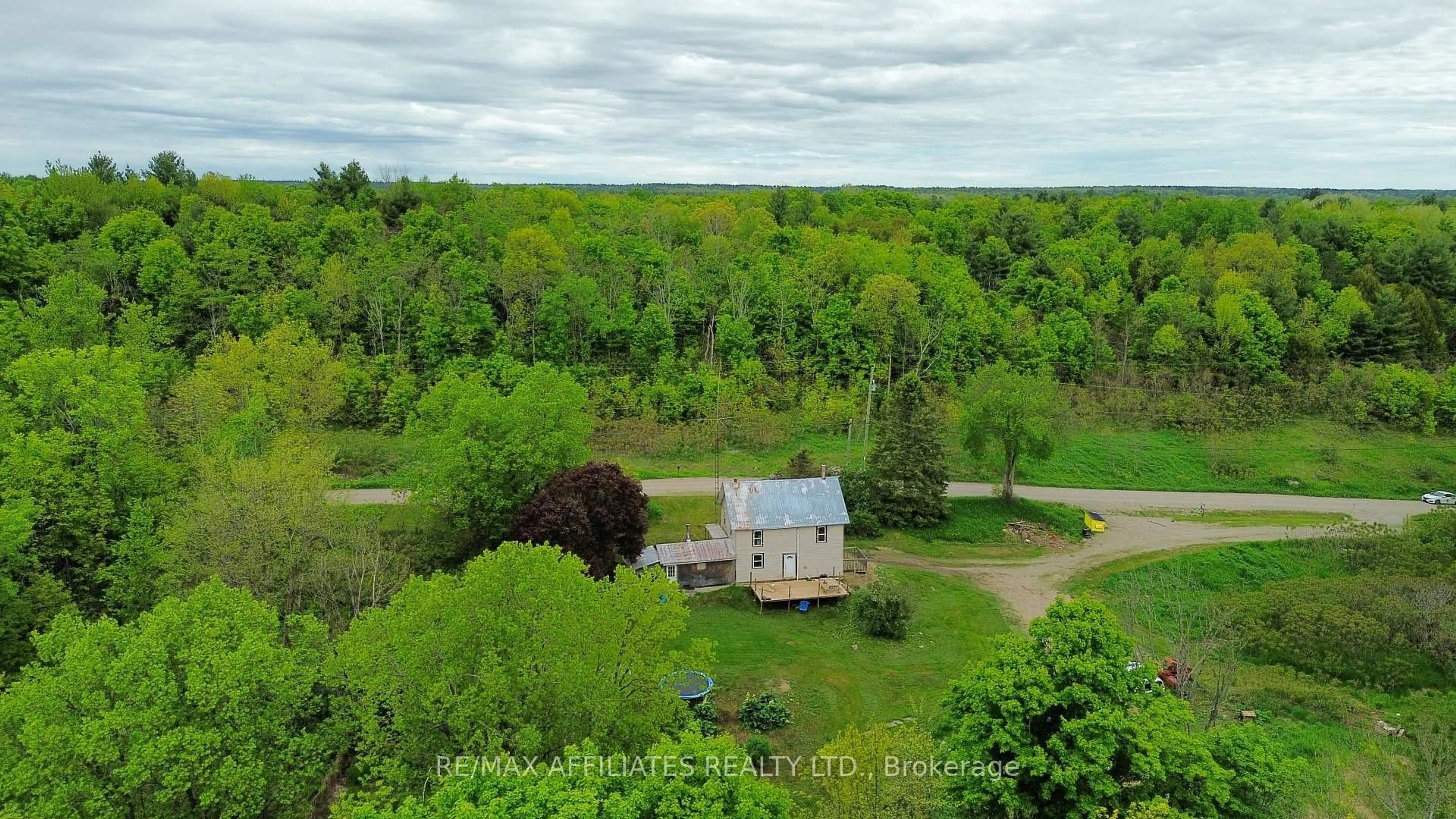 A pic from outside/outdoor area/front of a property/back of a property/a pic from drone, forest/trees view for 1505 Elm Tree Rd, Arden Ontario K0H 1B0