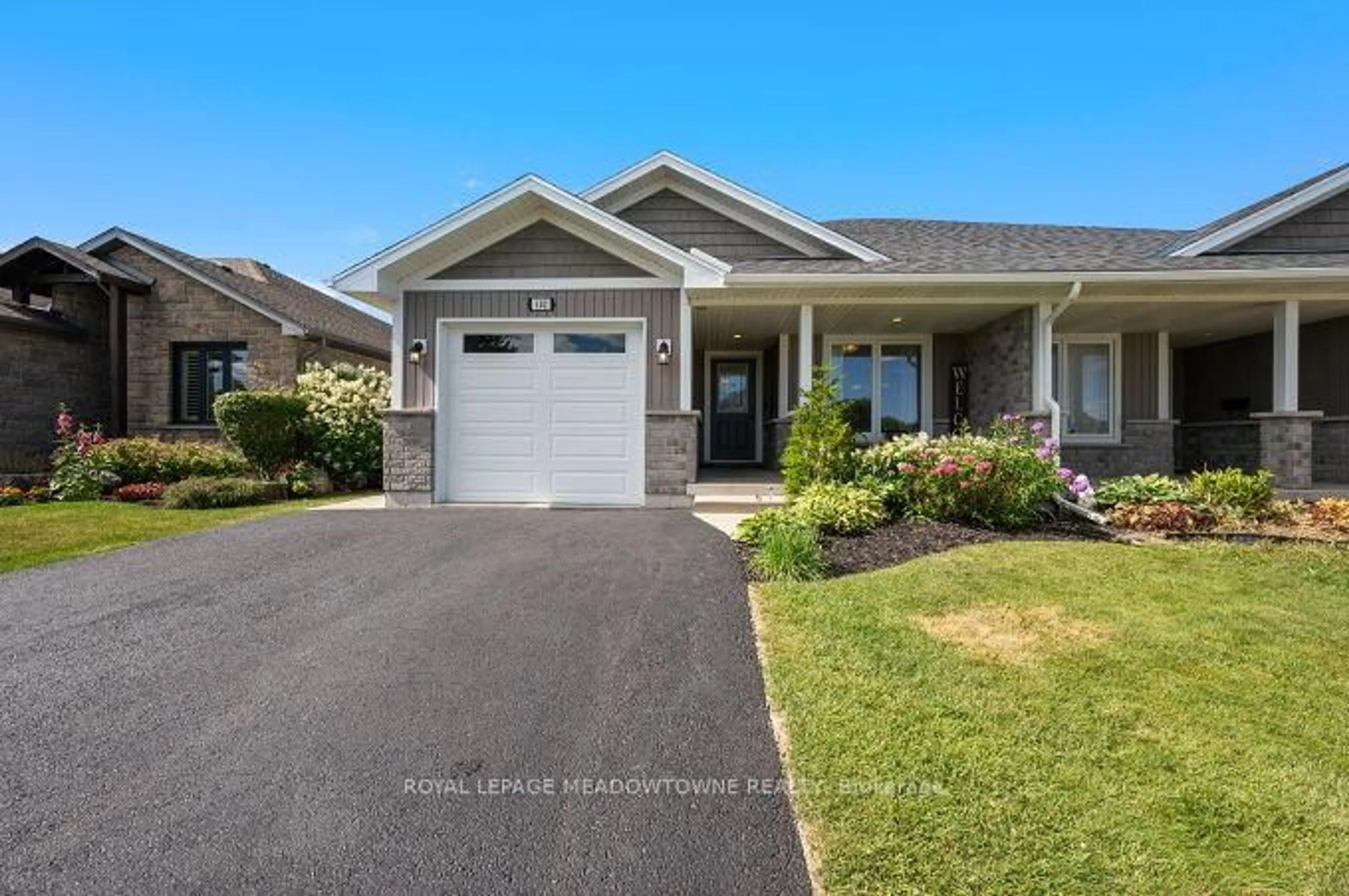 Home with vinyl exterior material, street for 102 Milton Seiler Cres, Minto Ontario N0G 2P0