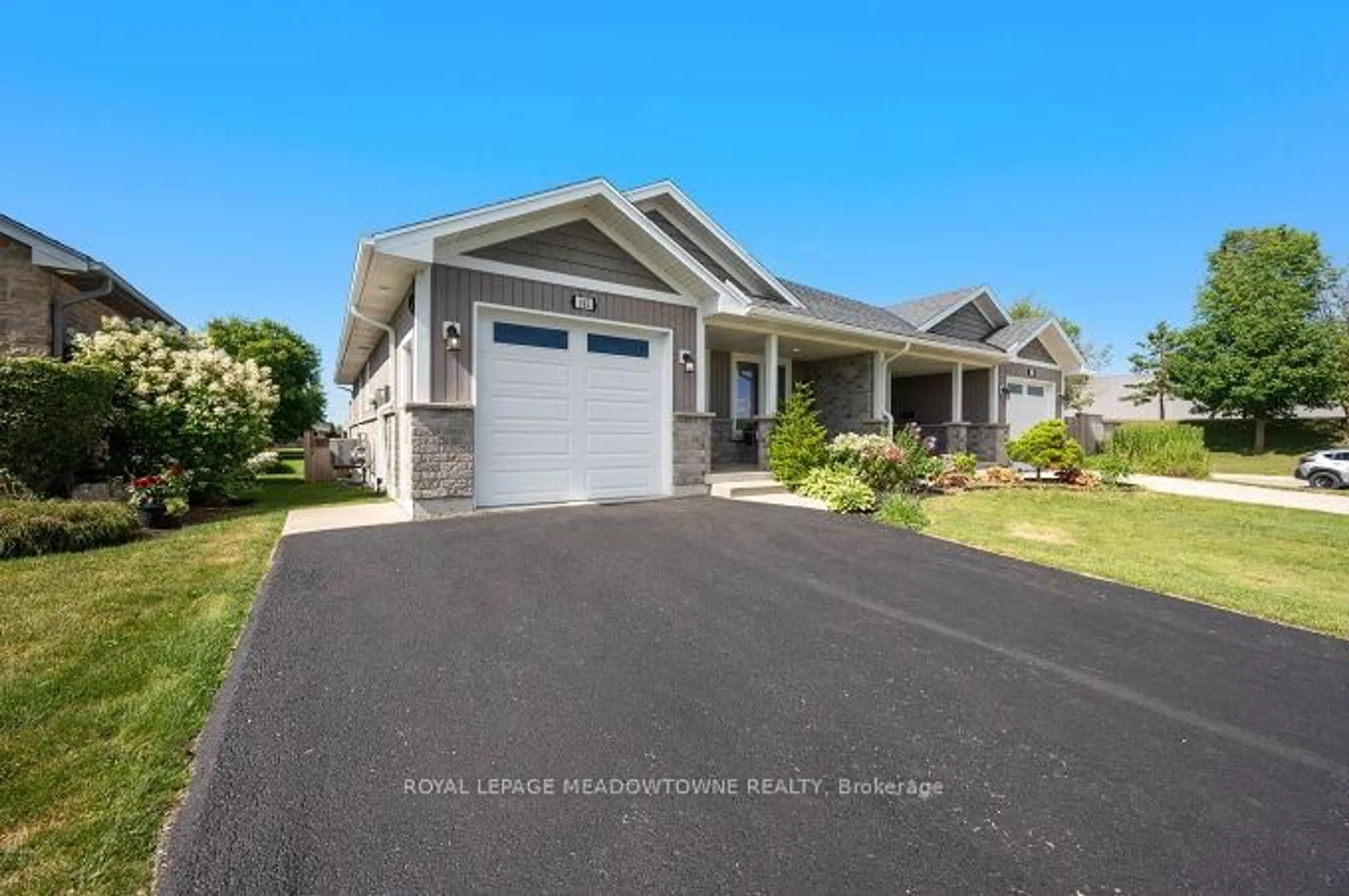 Home with vinyl exterior material, street for 102 Milton Seiler Cres, Minto Ontario N0G 2P0
