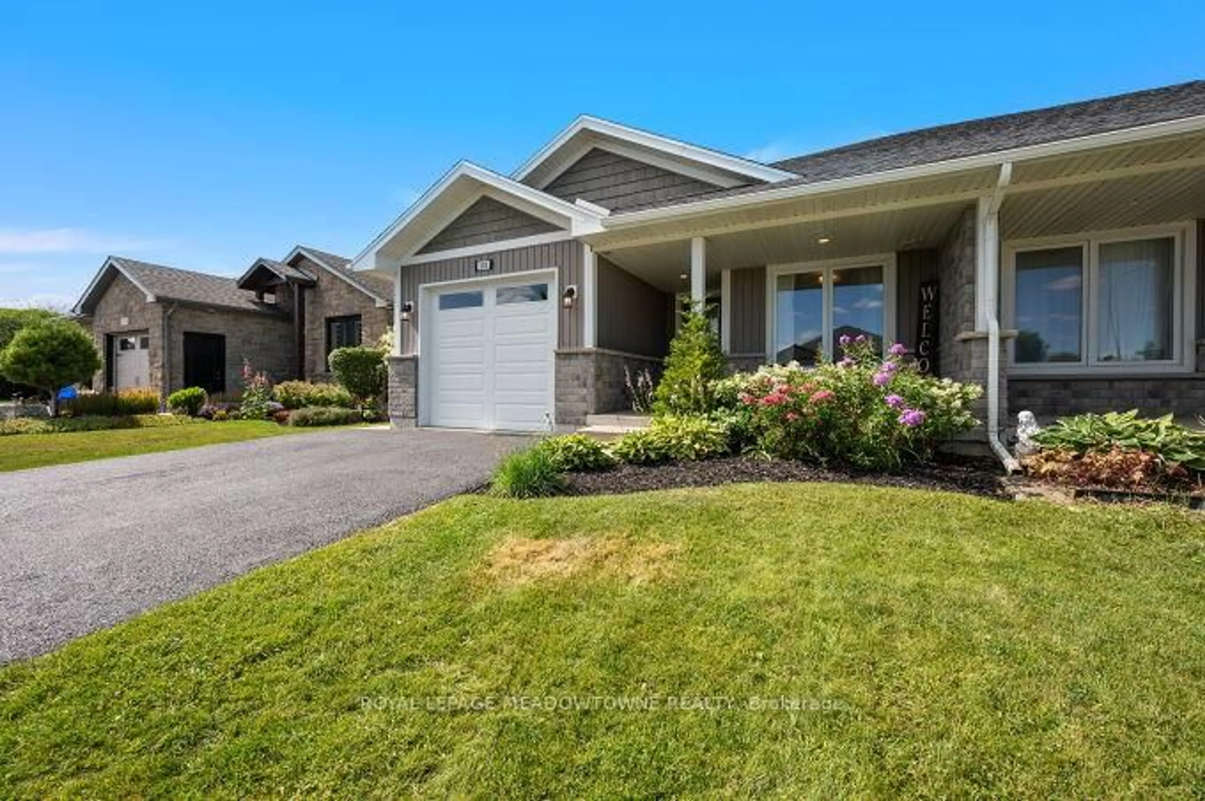 Home with vinyl exterior material, street for 102 Milton Seiler Cres, Minto Ontario N0G 2P0