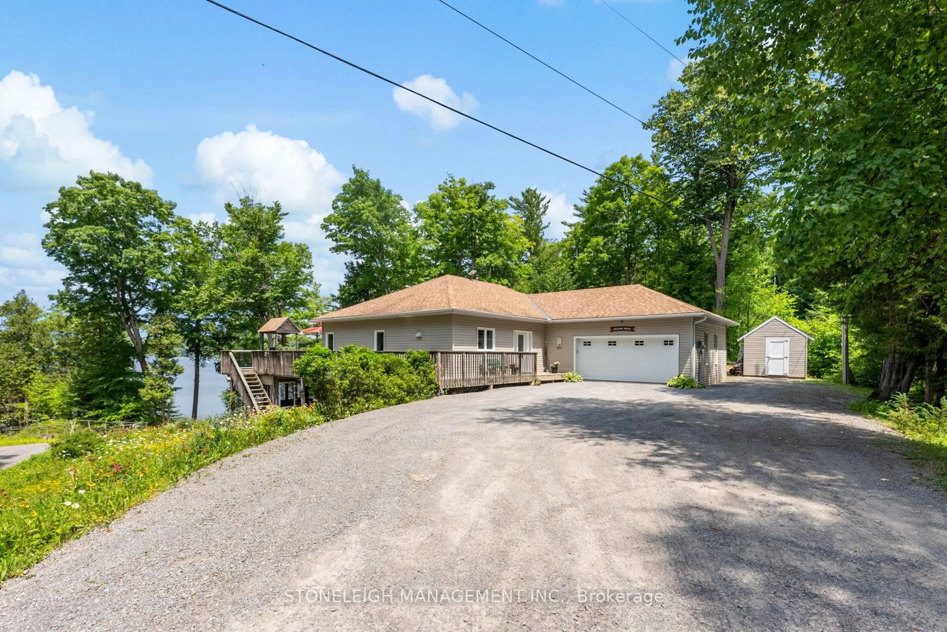 A pic from outside/outdoor area/front of a property/back of a property/a pic from drone, water/lake/river/ocean view for 15 2nd Heaven Lane, Verona Ontario K0H 2W0