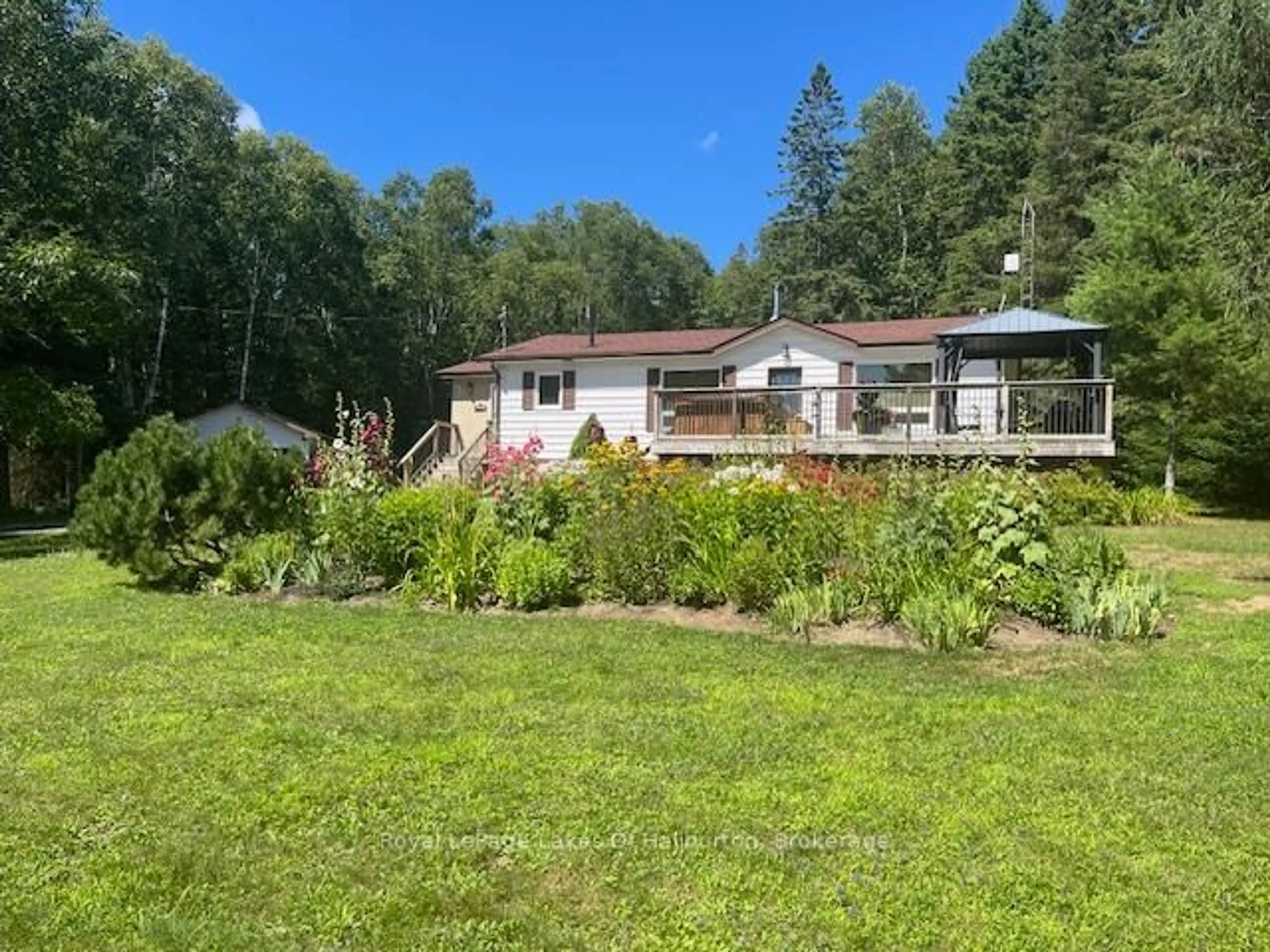 A pic from outside/outdoor area/front of a property/back of a property/a pic from drone, unknown for 1293 Green Lake Rd, Dysart et al Ontario K0M 1S0